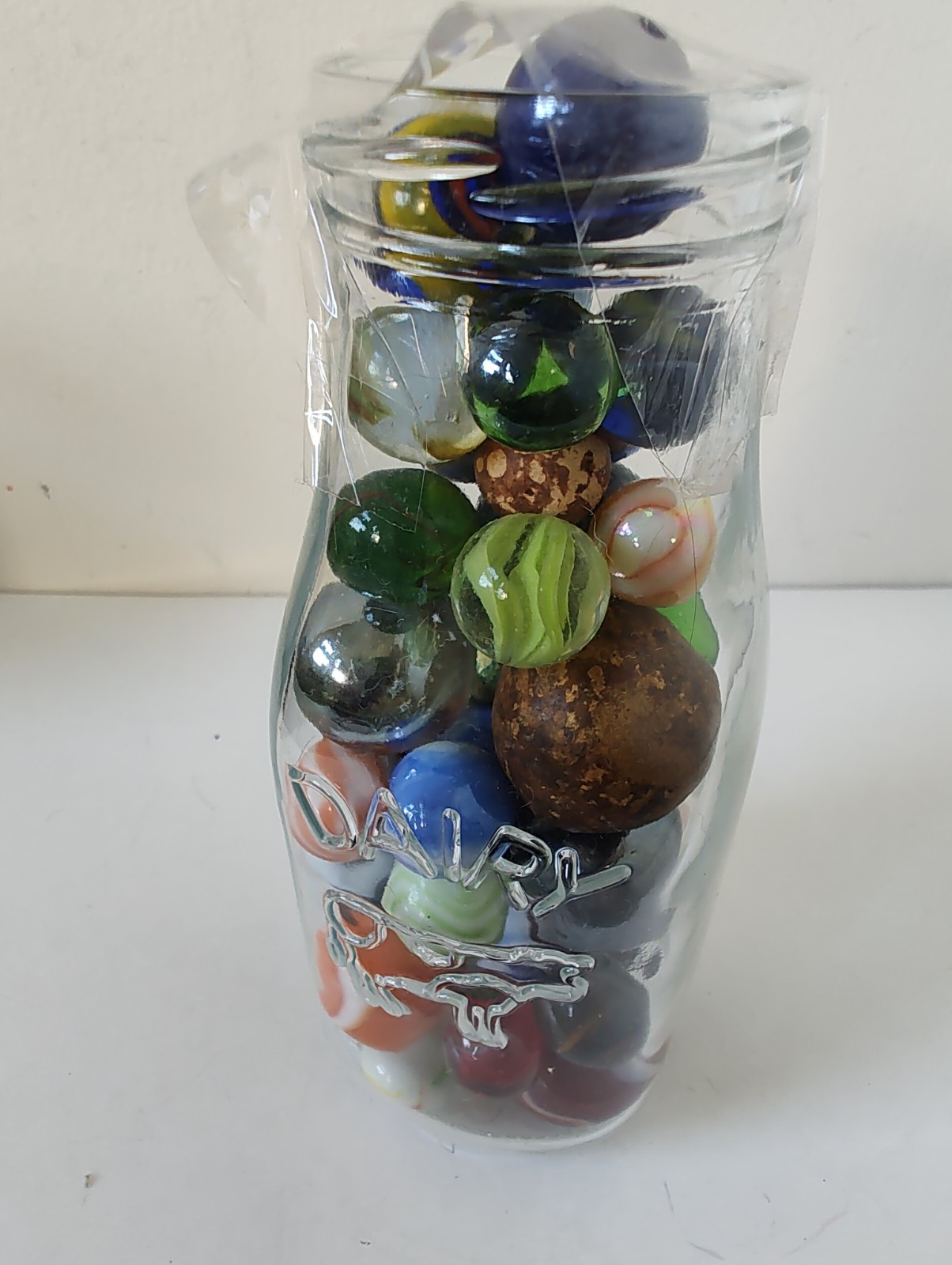 RARE VTG Marbles in 6″ Dairy bottle-cat eyes, shooters, & other various styles