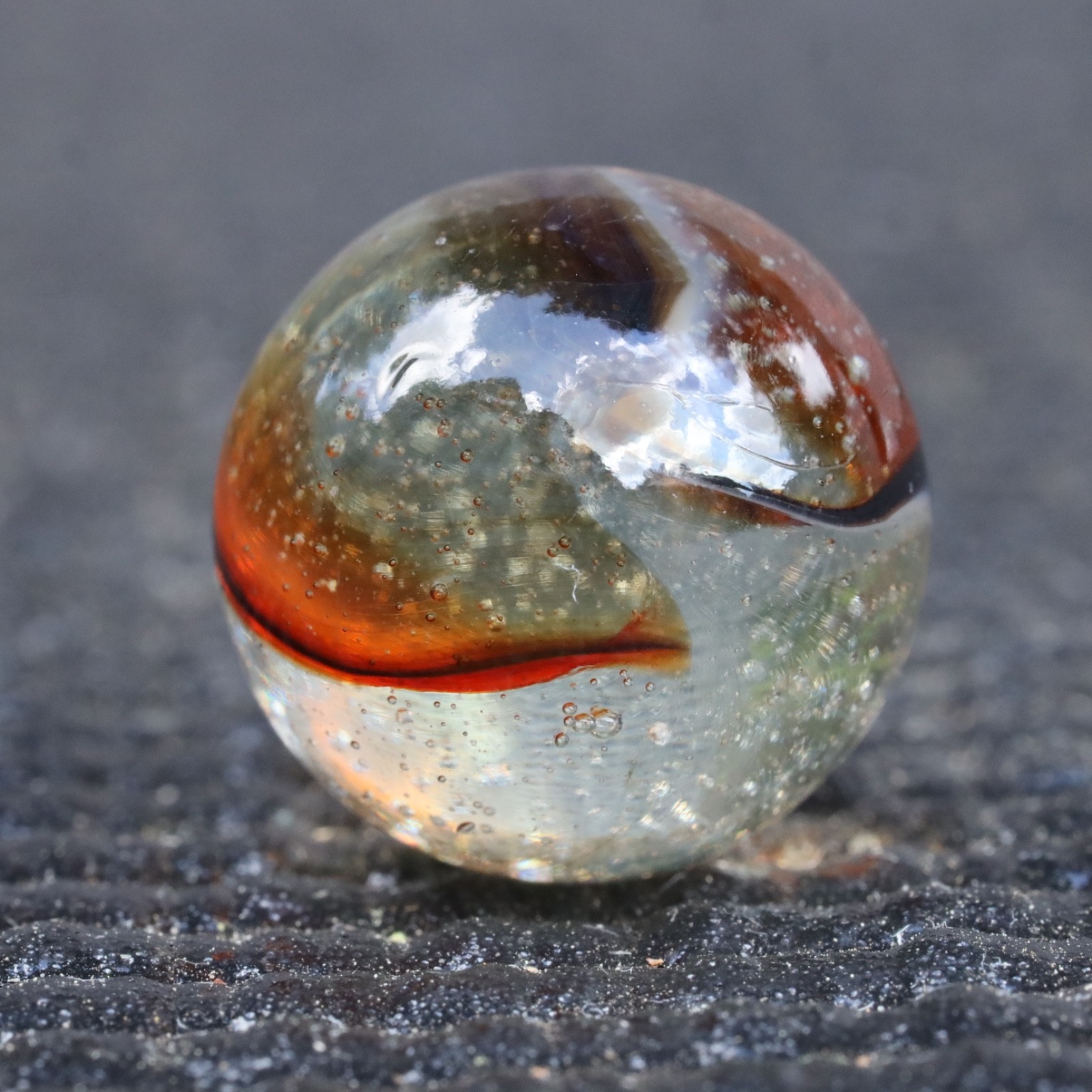 Peltier Clear Rainbo With Oxblood Ribbon Marble .598” M Condition