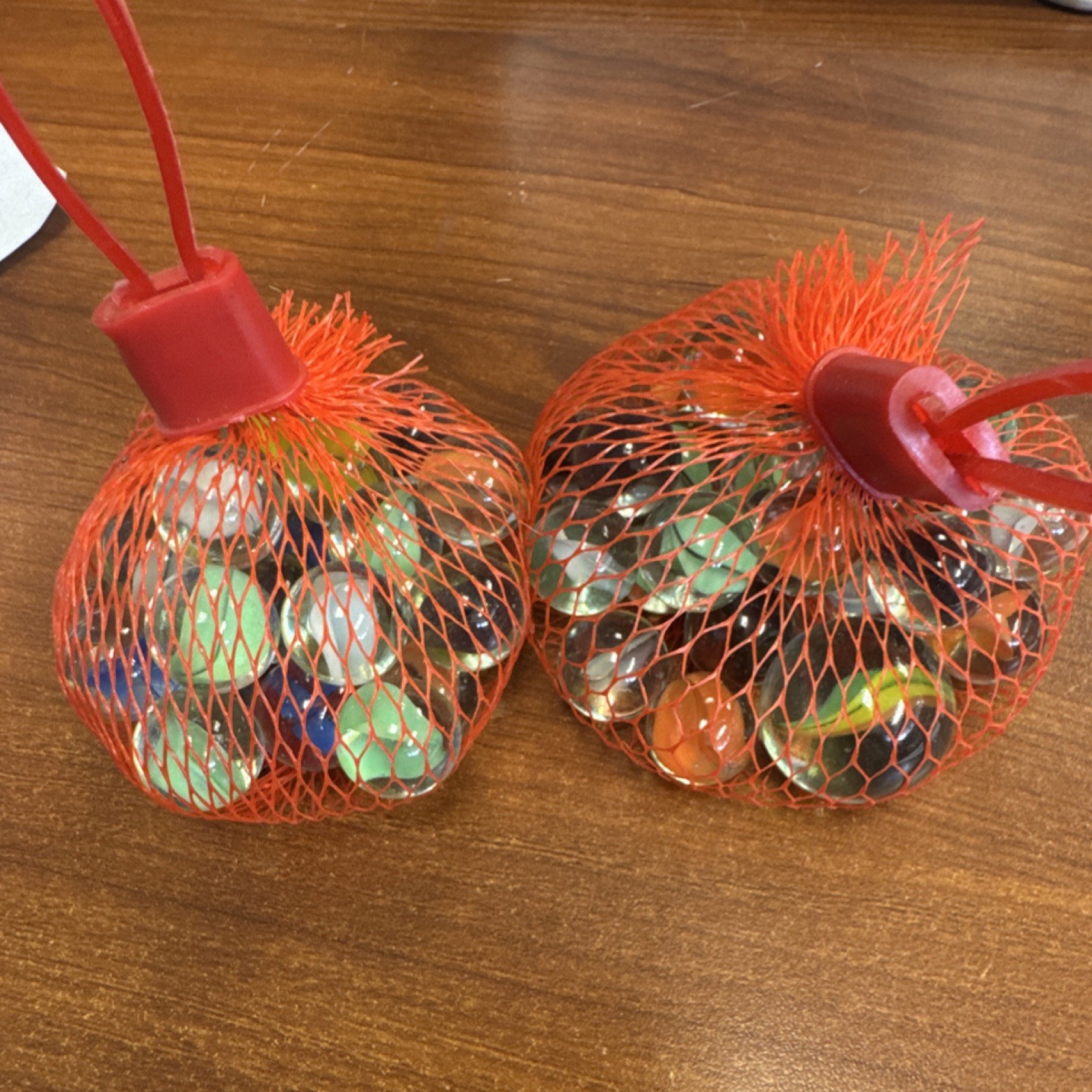 2 bags of Marbles in Red Mesh Bags roughly 3/4 pounds