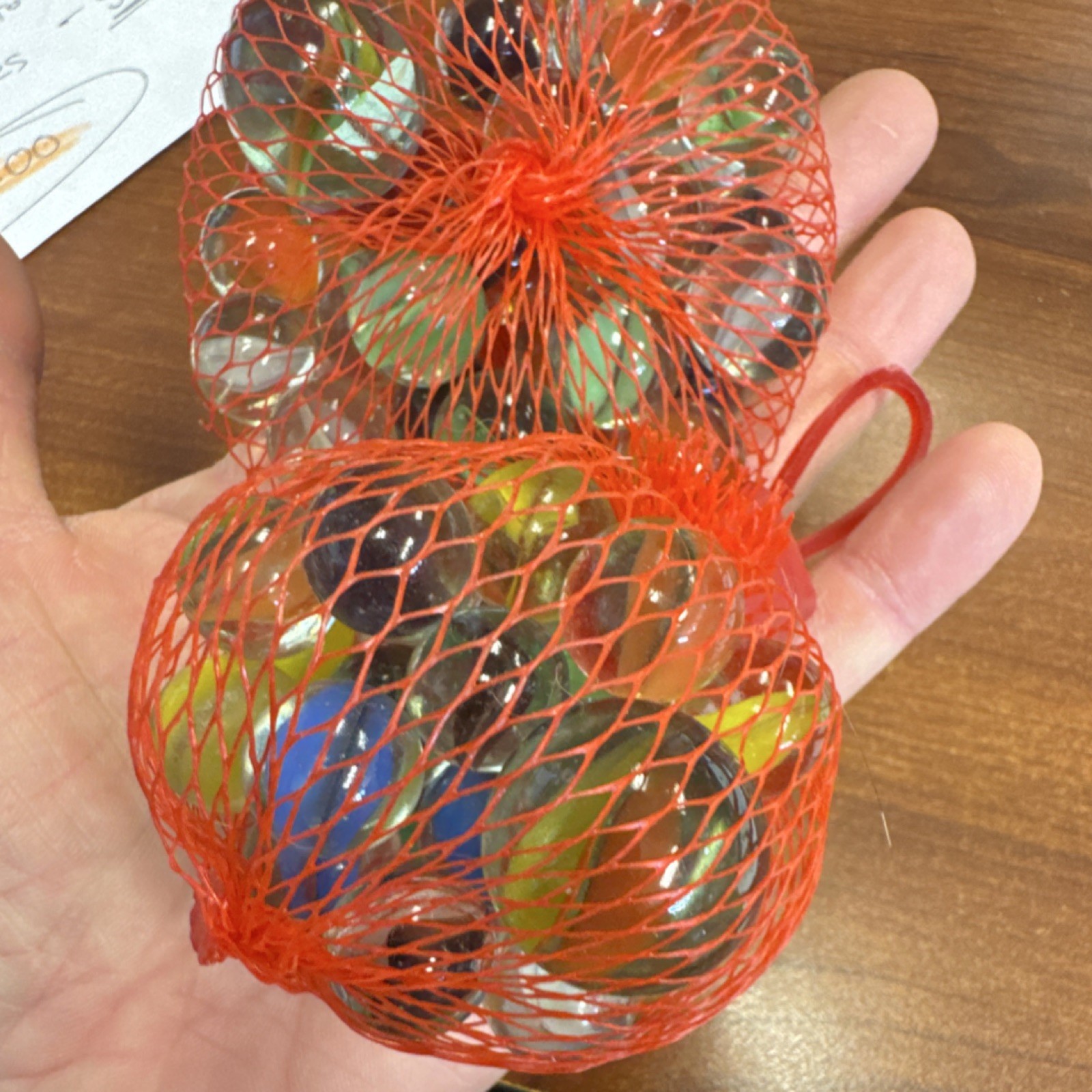 2 bags of Marbles in Red Mesh Bags roughly 3/4 pounds