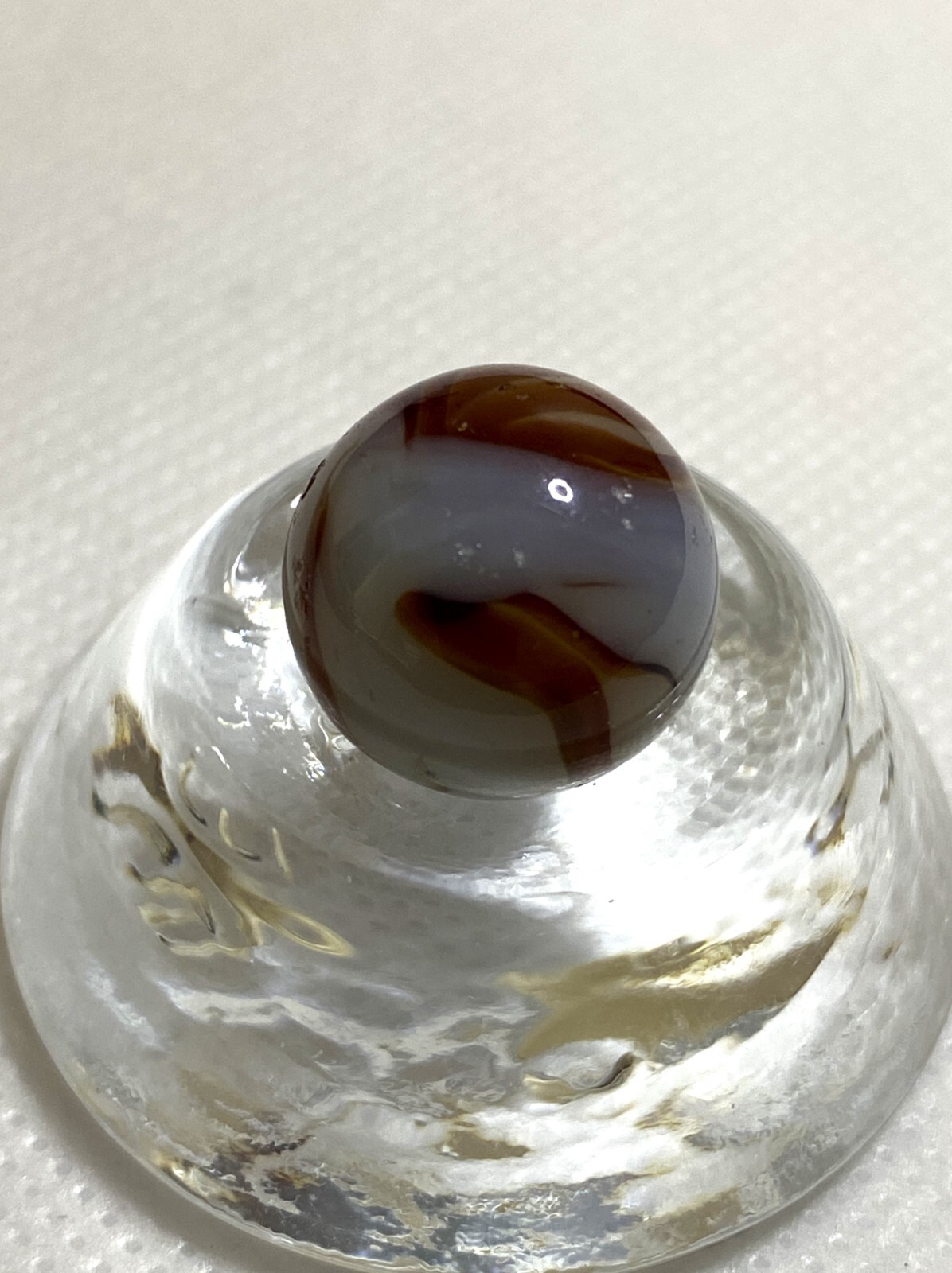 ALLEY AGATE CO. TRANSPARENT LIGHT BROWN FLAME SWIRL .63″ NM – MAA149