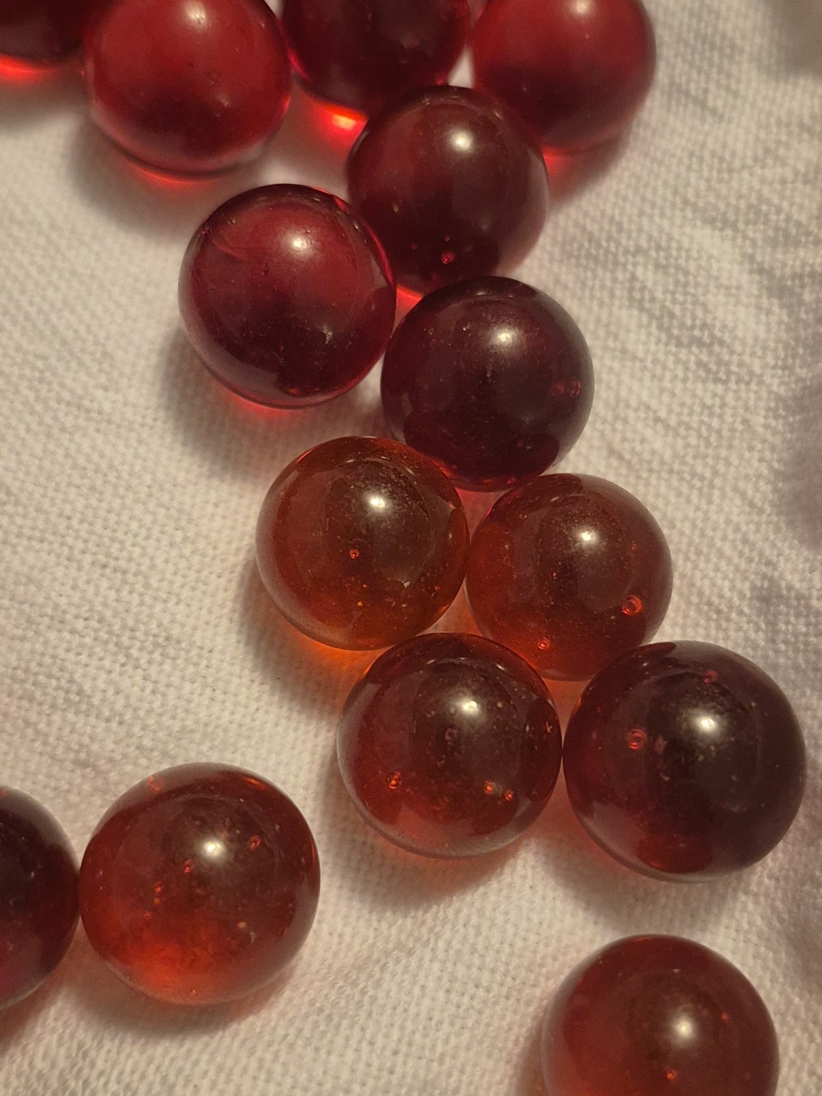 125 Red Translucent Glass Marbles, Machine Made