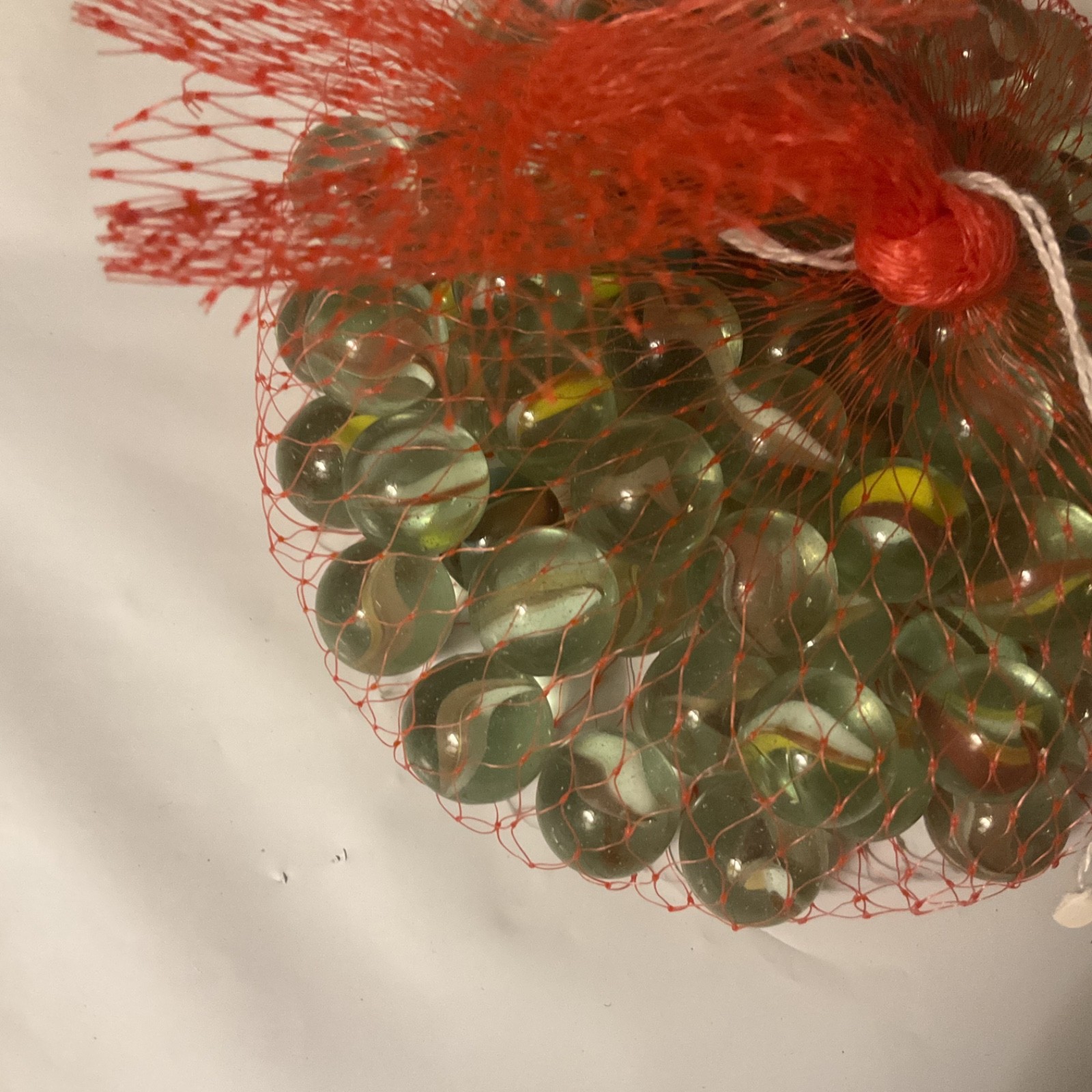 Glass Marble Set – Netted Bag of Approx 31 Assorted Marbles, One Big One.