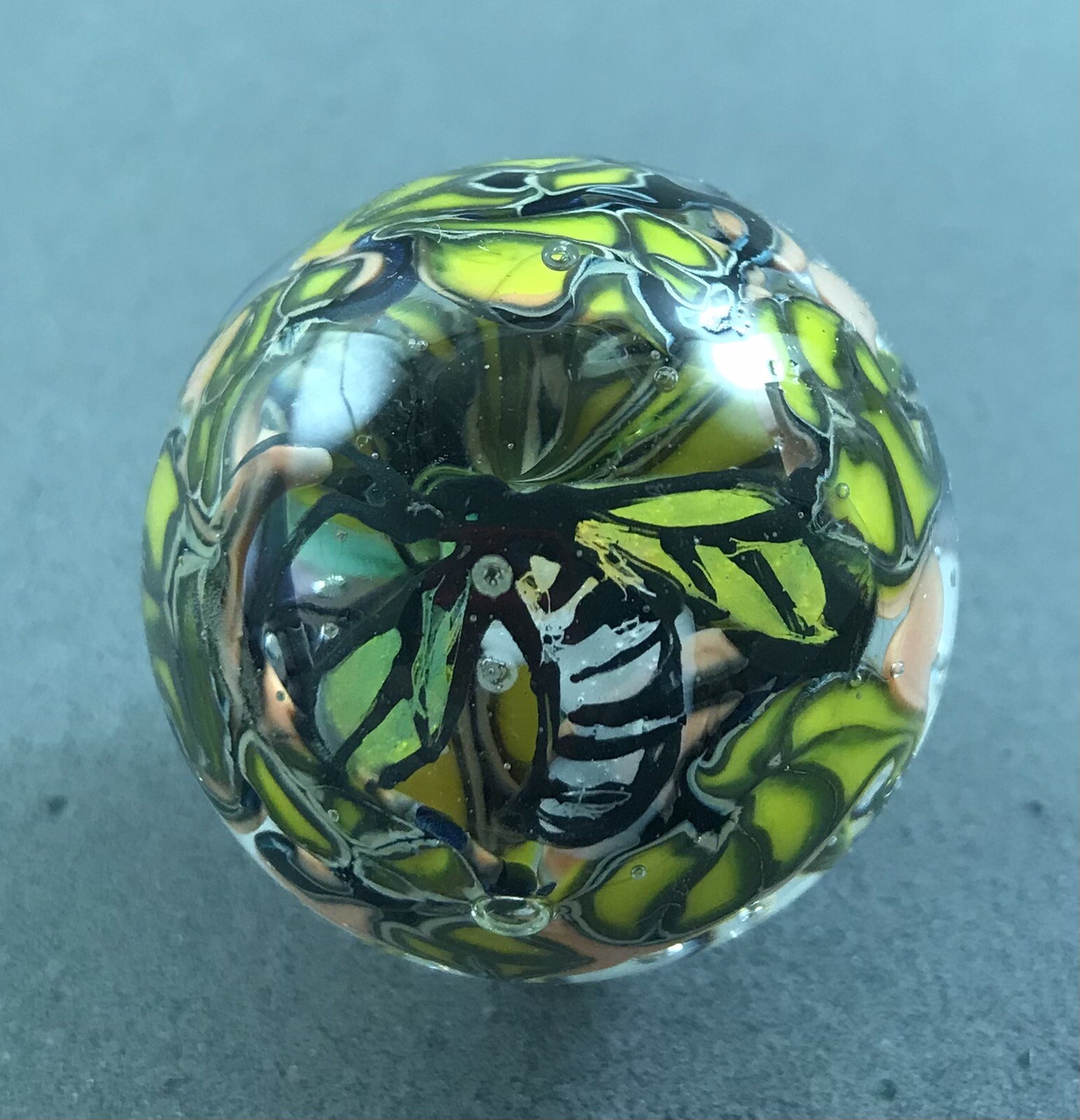 handmade 1 3/4” Purple Murrini Floral glass marble W/ Hand Painted Bug