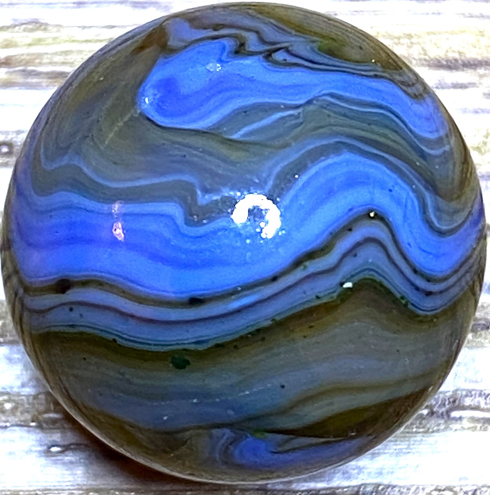 DAS/JABO WAVY BLUE AND TRANSPARENT OXBLOOD SWIRLED SHOOTER .69″ BOX03/350