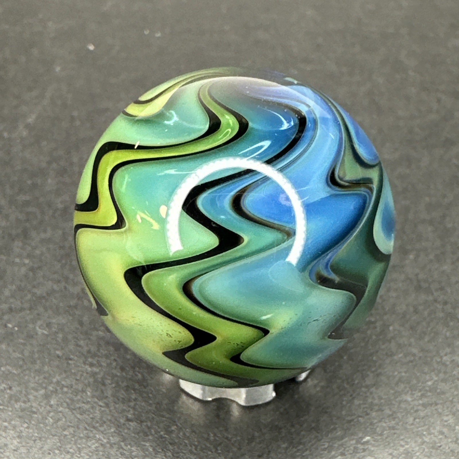 Contemporary Art Glass Marble 1″ Fumed Blue Green Wigwag W/ UV Reactive Glow!