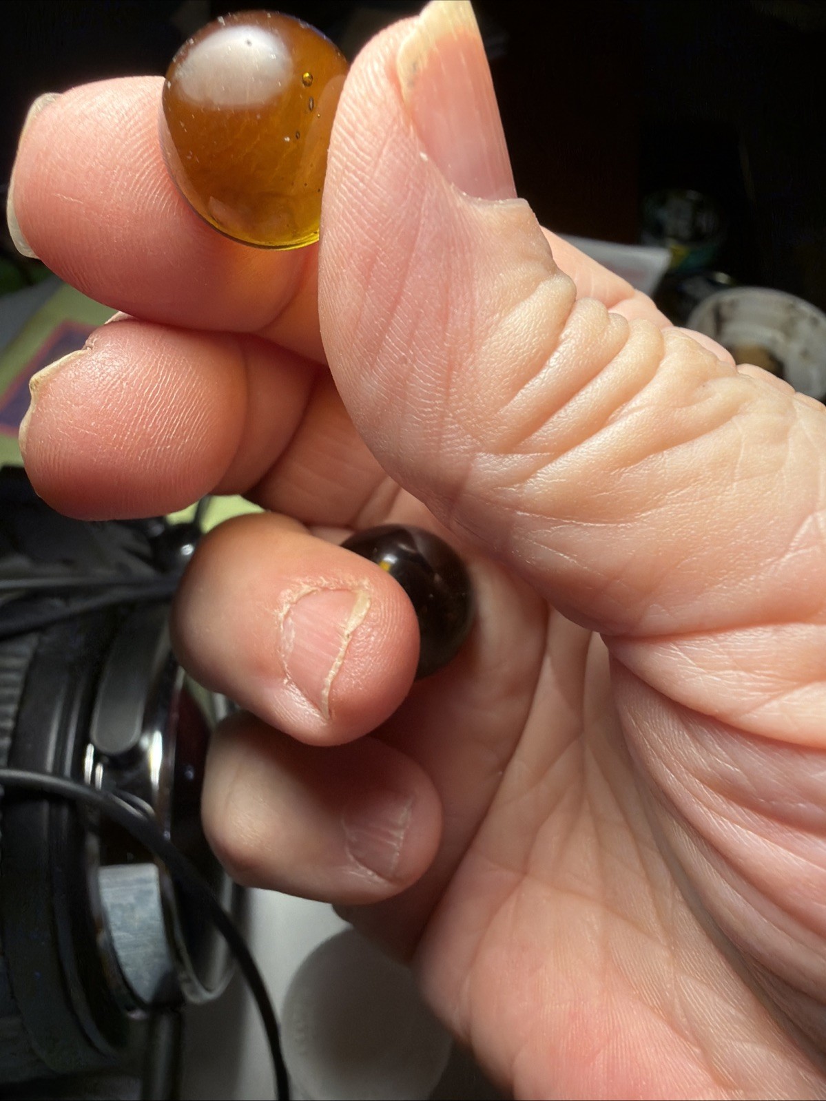 2 Marbles 1 Red/Amber Color And 1 Yellow/gold Color
