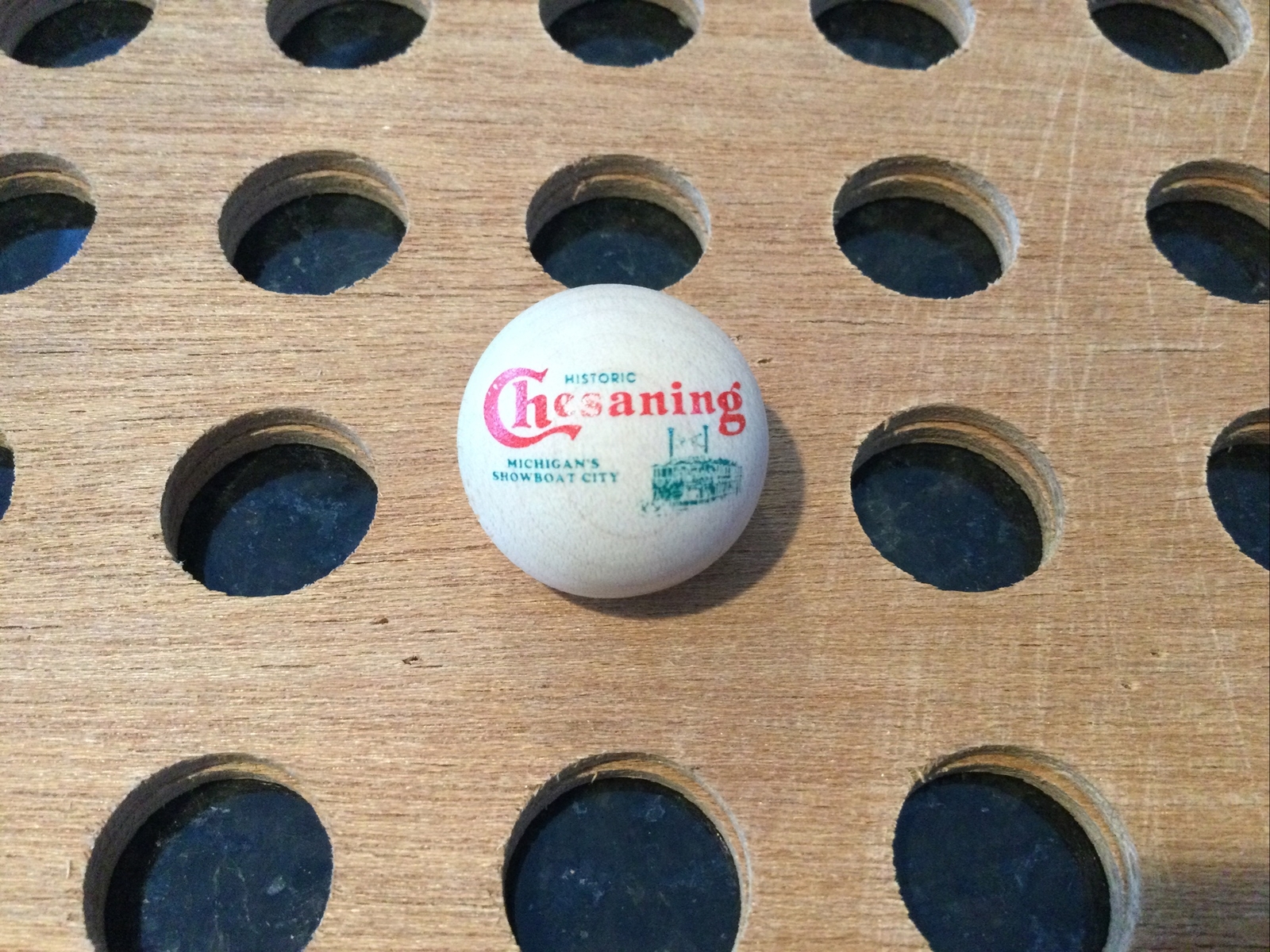Vintage | “Chesaning Michigan’s Showboat City” Marble | Wood, Red, & Green