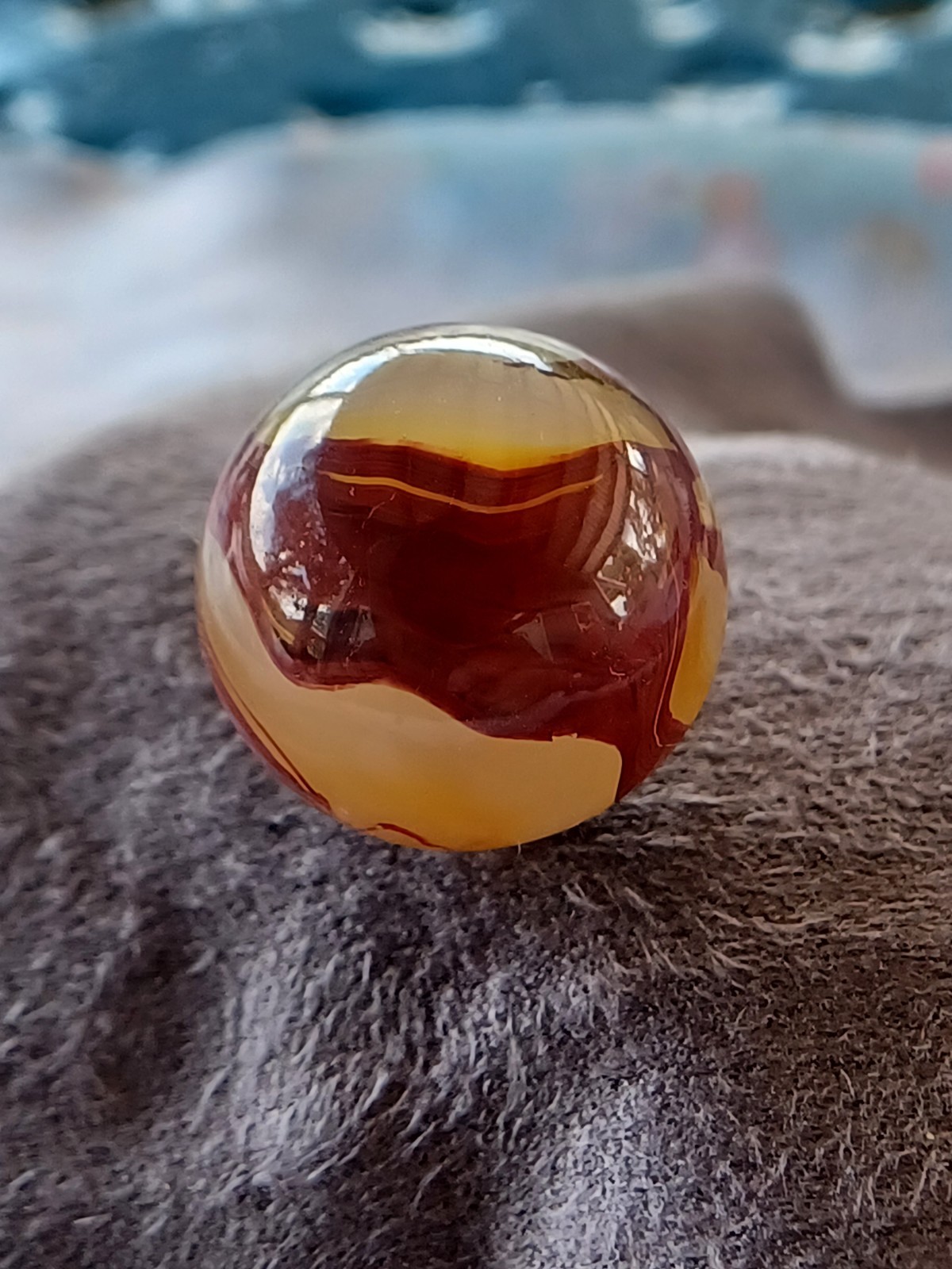“Golden Onyx Oxblood” .70 Shiney wet dead mint. Very old and rare marble. 1920s