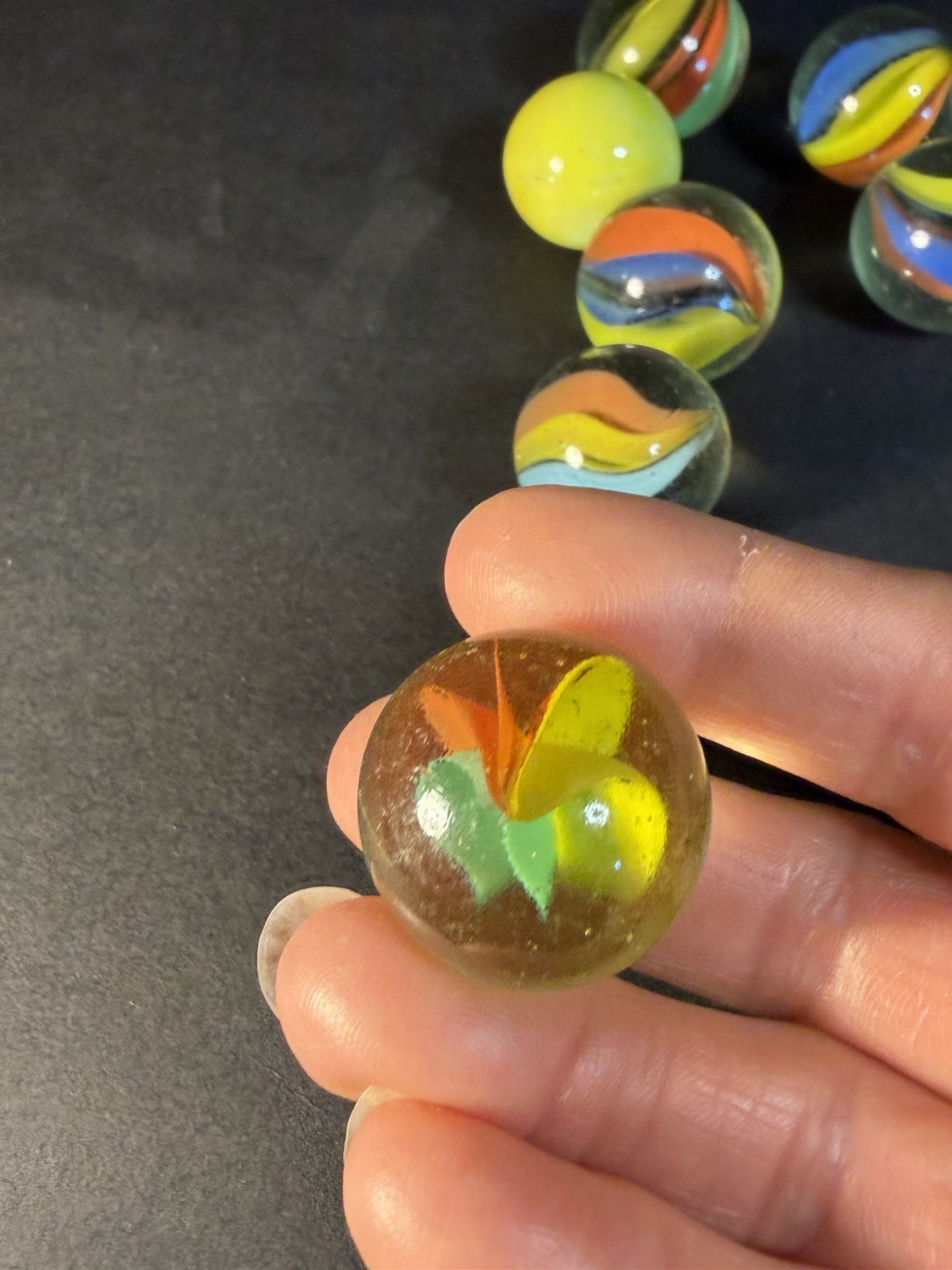 6 Cats Eye 1” Shooter Marbles Plus Two Other Solid Color Marbles