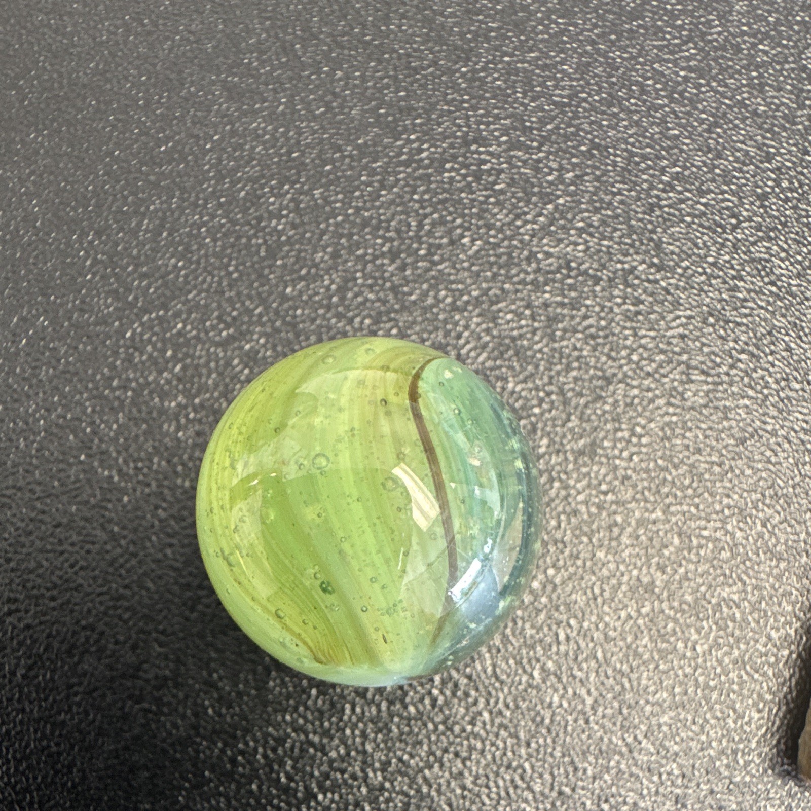 Marble. Glass. Swirl. Many colors- Green, white, blue, pinkish purple