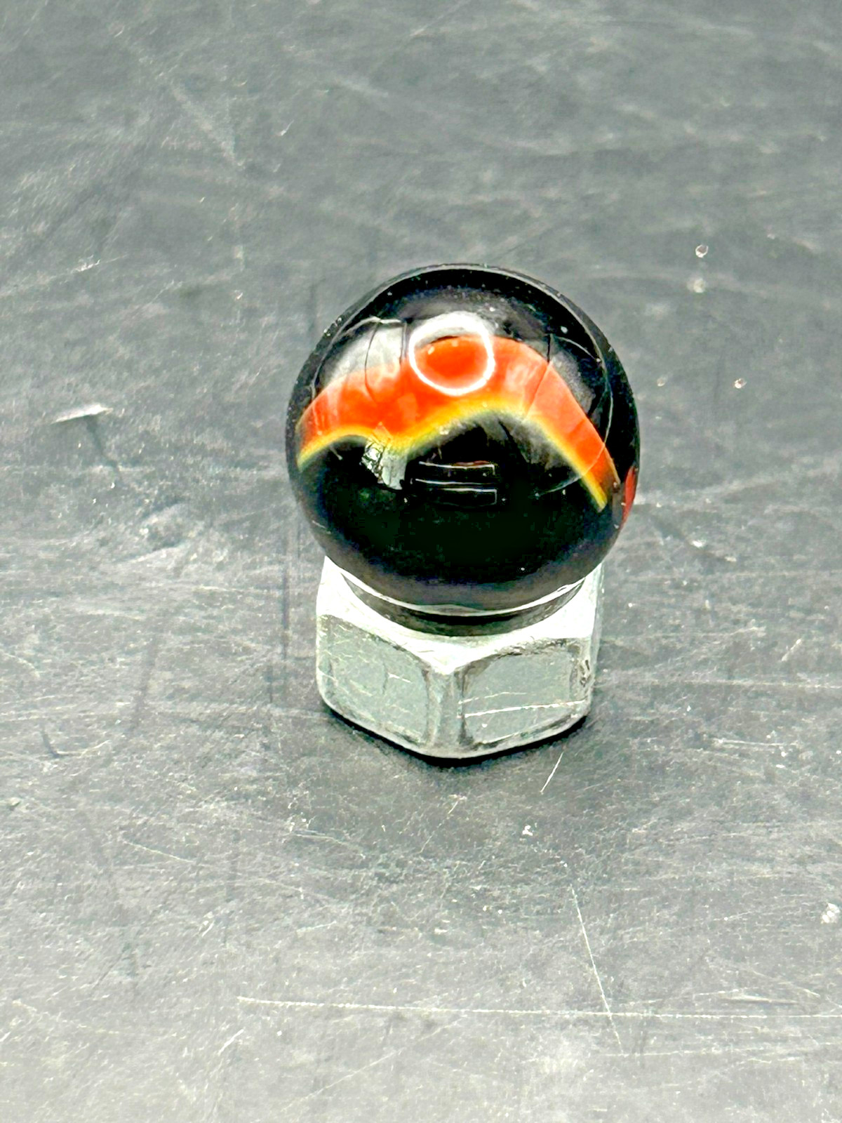 Vintage Peltier Rainbo Marble, Black Base/Orange Ribbon, .62″, Mint, #P20