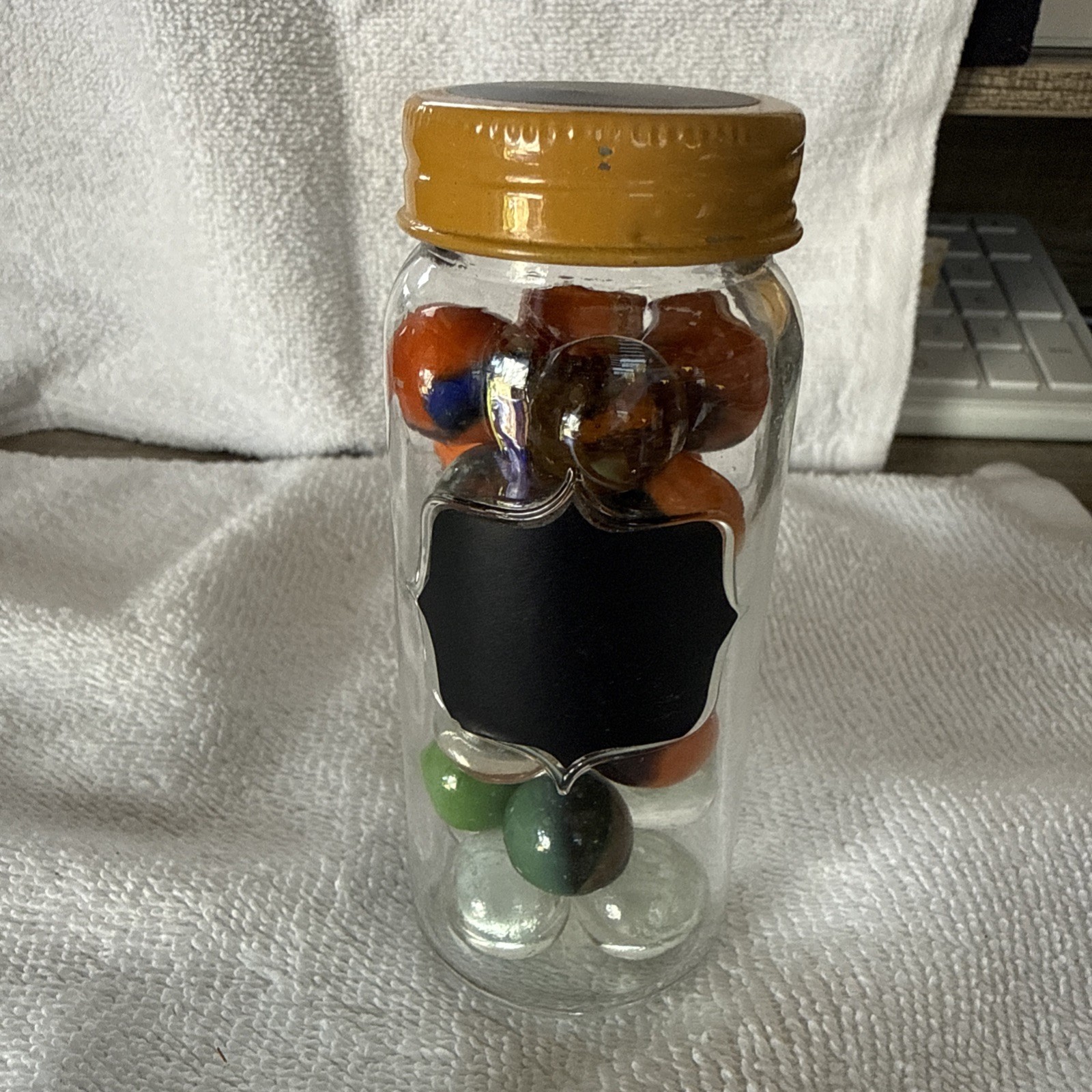 A Jar Of 24 Marbles Including The Jar, Which Is Kind Of Cool Looking!