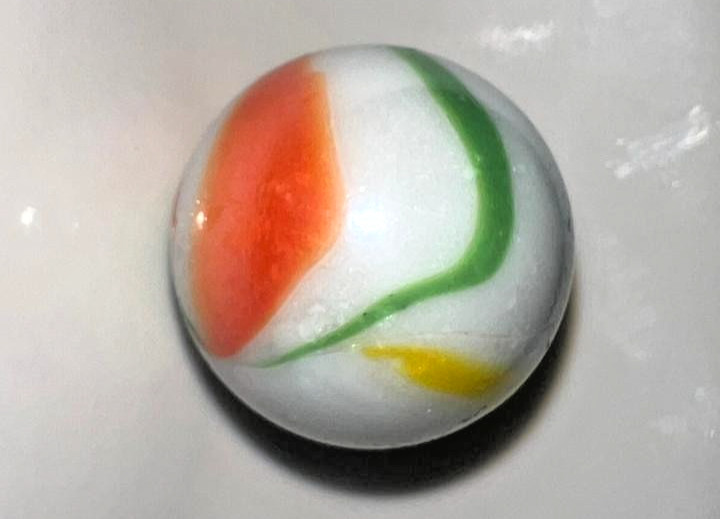 9 classic handmade glass marbles, featuring colorful swirls and unique patterns.