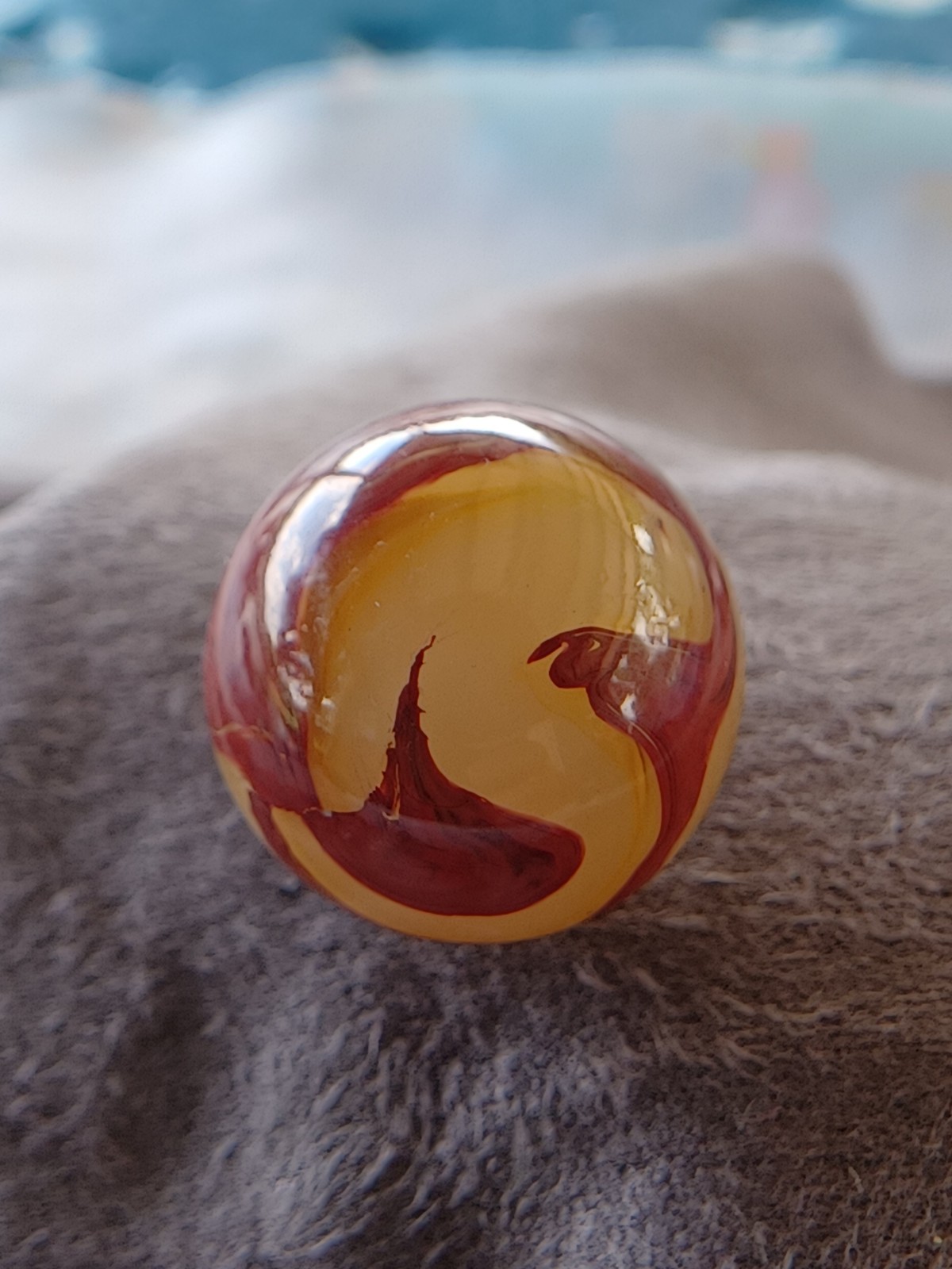 “Golden Onyx Oxblood” .70 Shiney wet dead mint. Very old and rare marble. 1920s