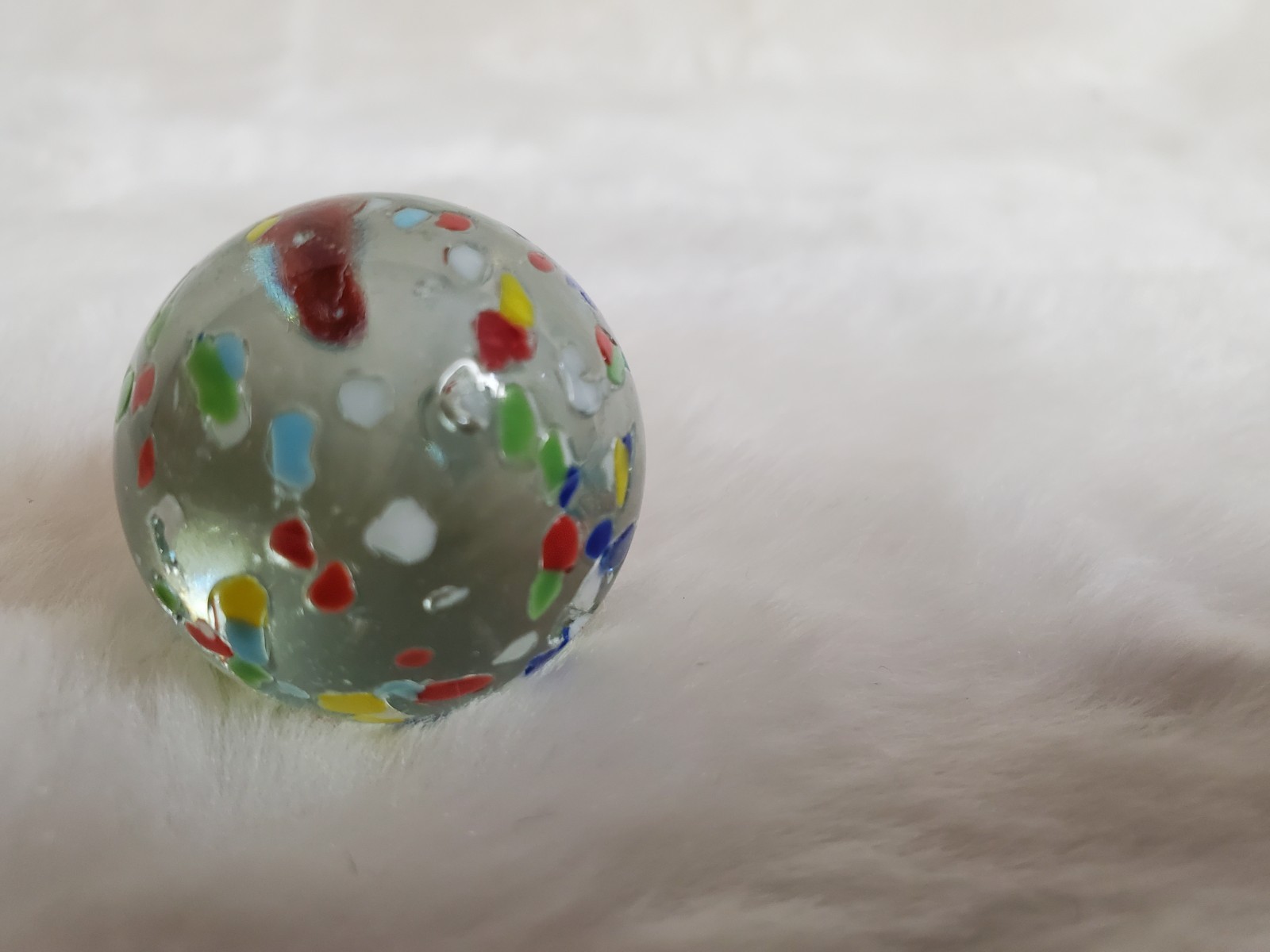 1″ Vintage confetti shooter marble – clear glass w/ multi colors on surface