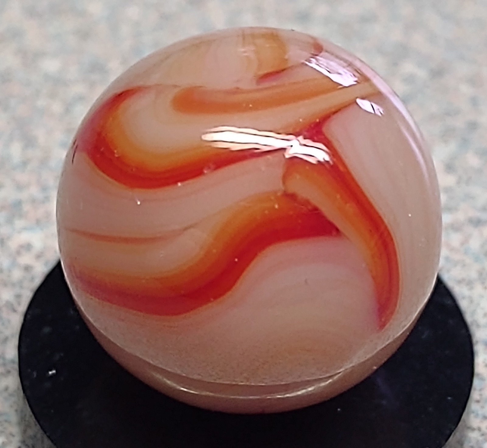 West Virginia Swirl marble-.59″ Mint-, red/orange swirls, mossy Transl. base-***