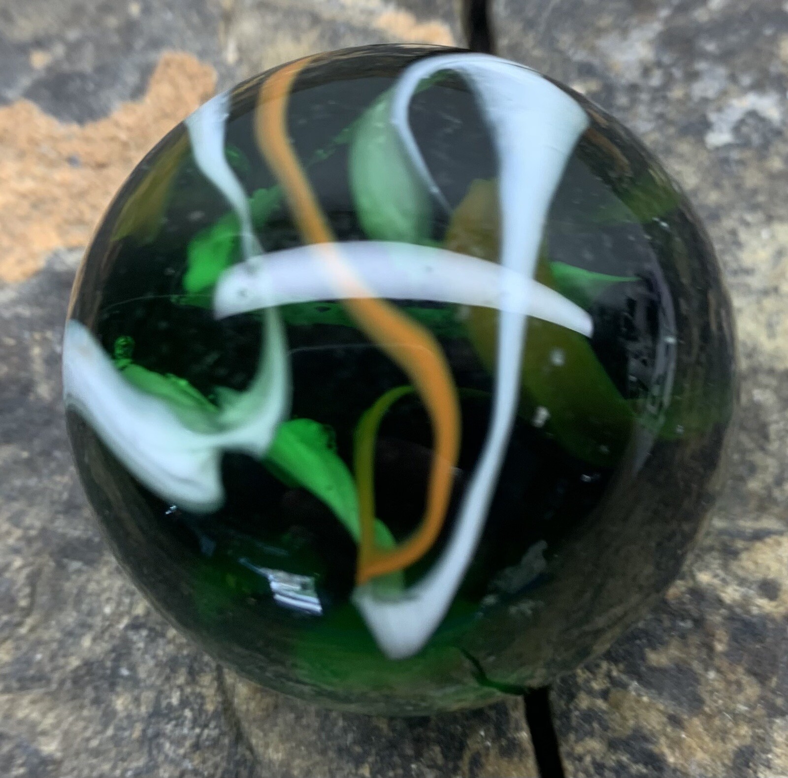 Glass Marble 1.5” In Diameter. Used. Green With Swirls