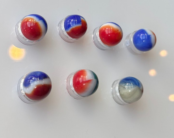7 VTG Glass Marbles-6 Red White Blue, 1 Red White Green, Approx .57″-.62″ Lot 12