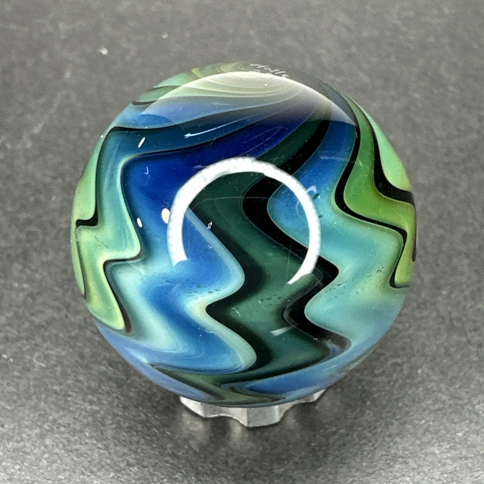 Contemporary Art Glass Marble 1″ Fumed Blue Green Wigwag W/ UV Reactive Glow!