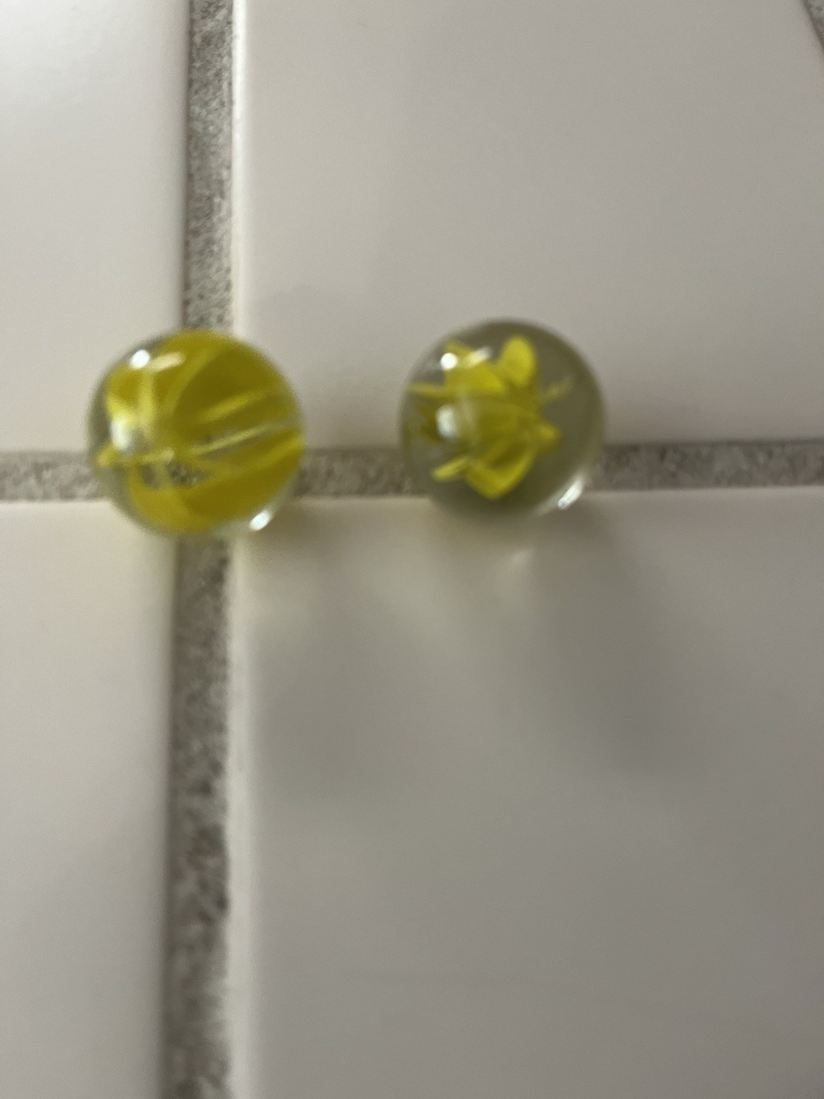 Two Vintage Vitro Agate Caged Cats Eye Shooter Marbles