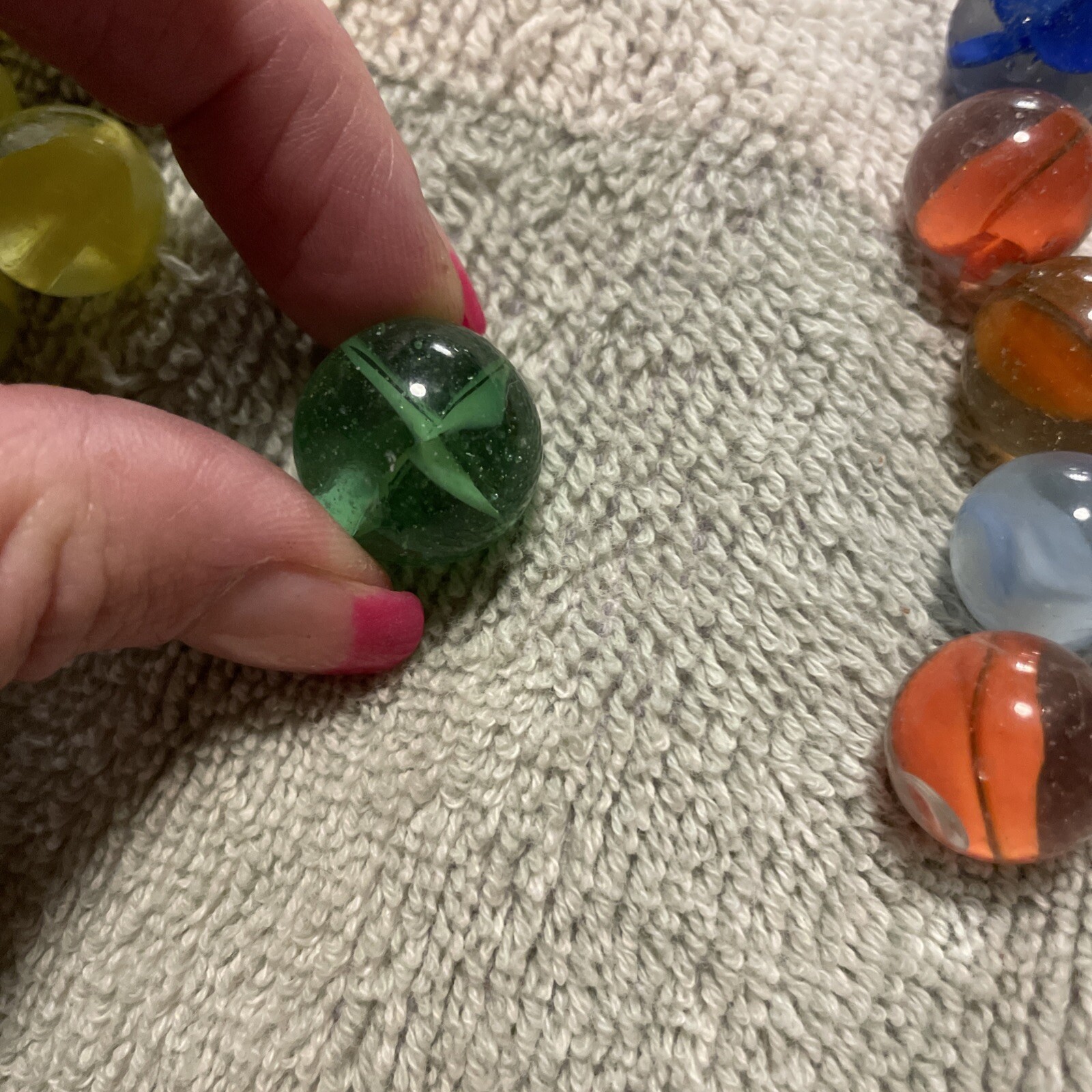 1930-1940’s cat eye 4 vein marbles. Total 12, 1 In, .75 , 10 .50