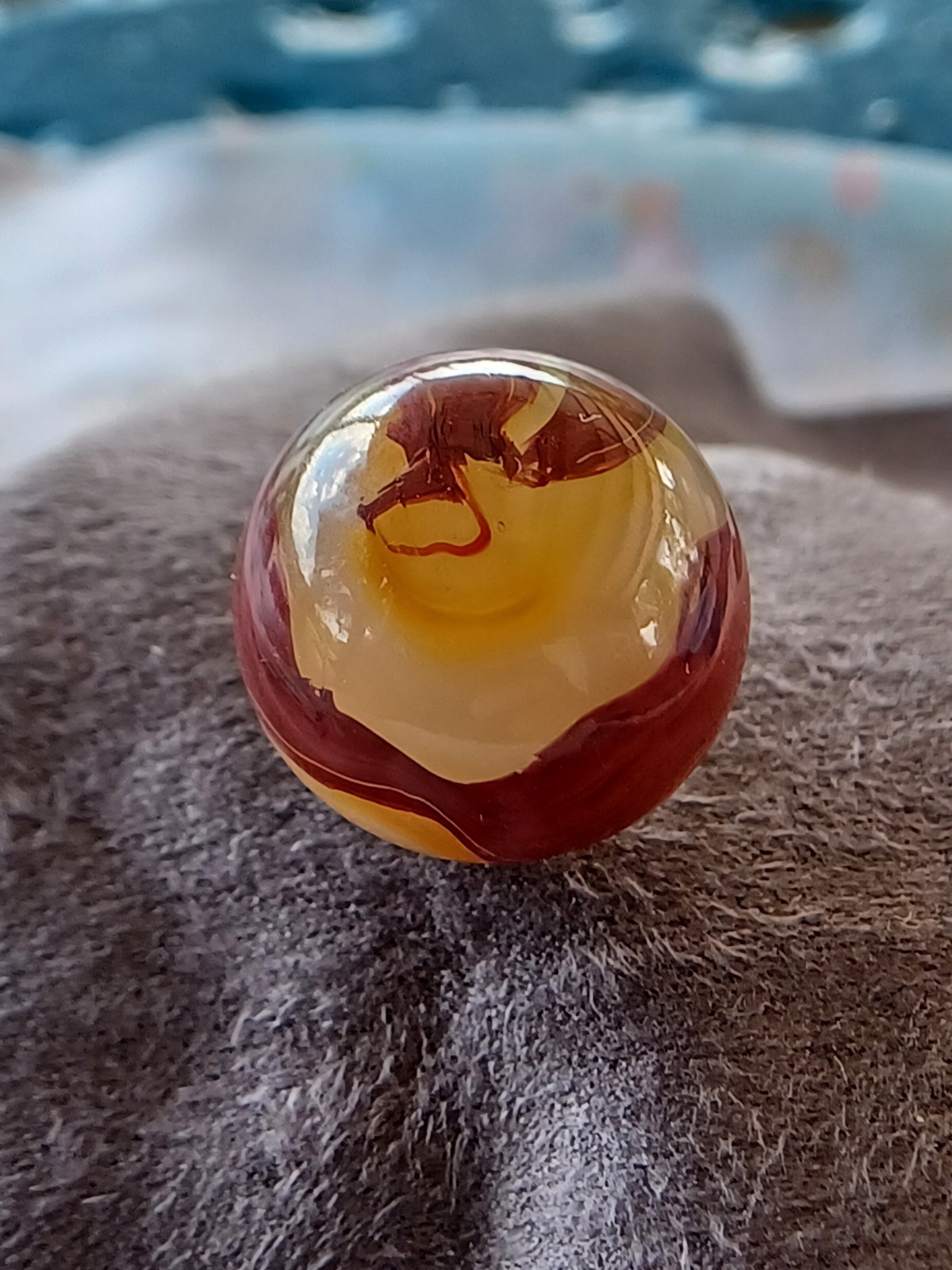 “Golden Onyx Oxblood” .70 Shiney wet dead mint. Very old and rare marble. 1920s