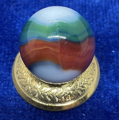 A Vintage Marble King Blended Three Color Marble. Measures .62” Mint Condition.