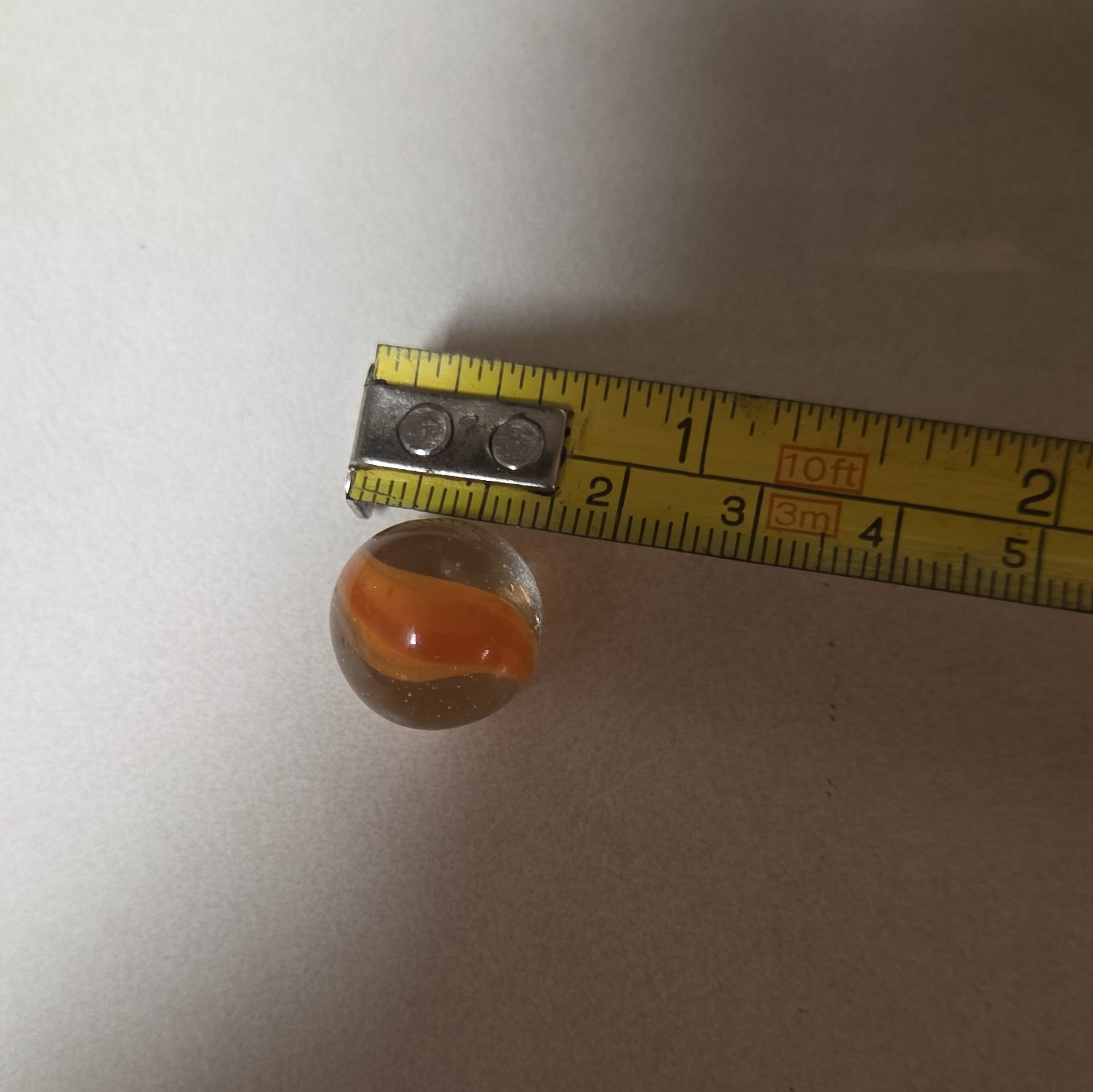 Clear Glass Toy Marble with Orange Swirl Pattern – Age 17 Years & Up