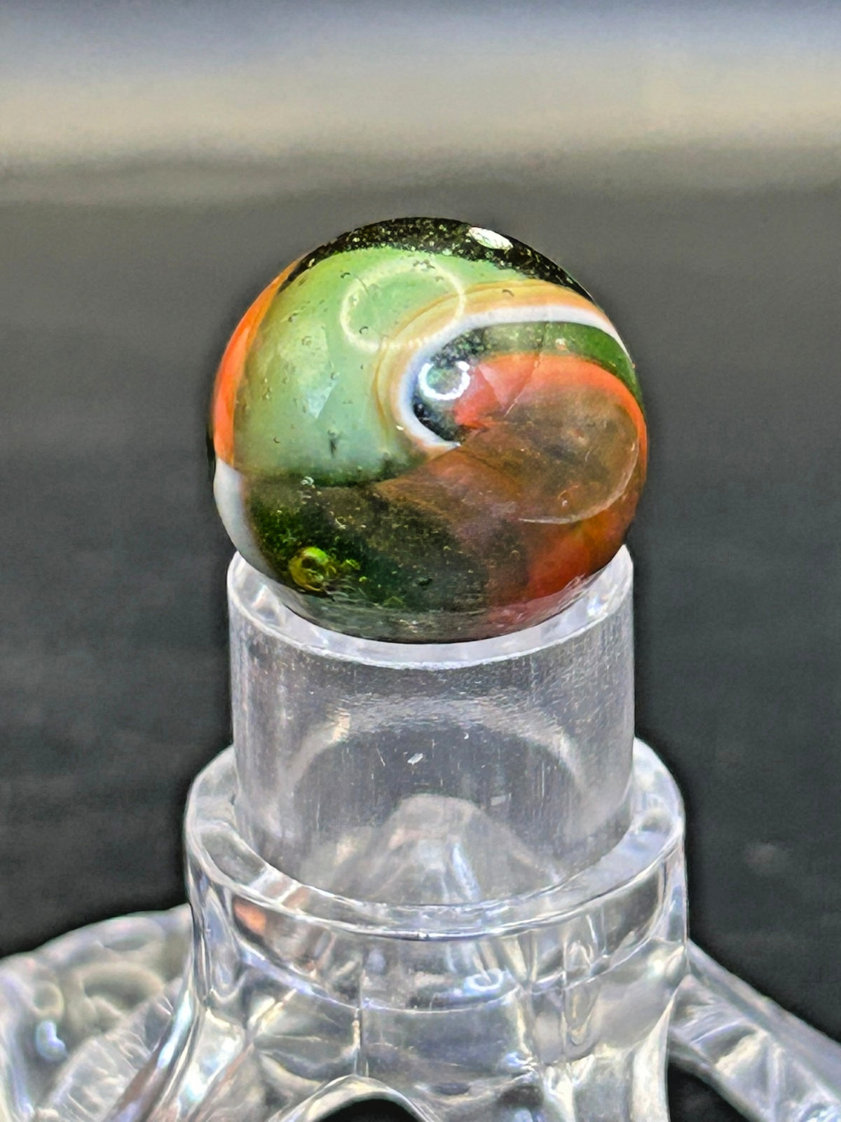 Peltier NLR Tri-Lite Marble, Green Base/Orange-Red Ribbon, UV Reactive, .63″ P28