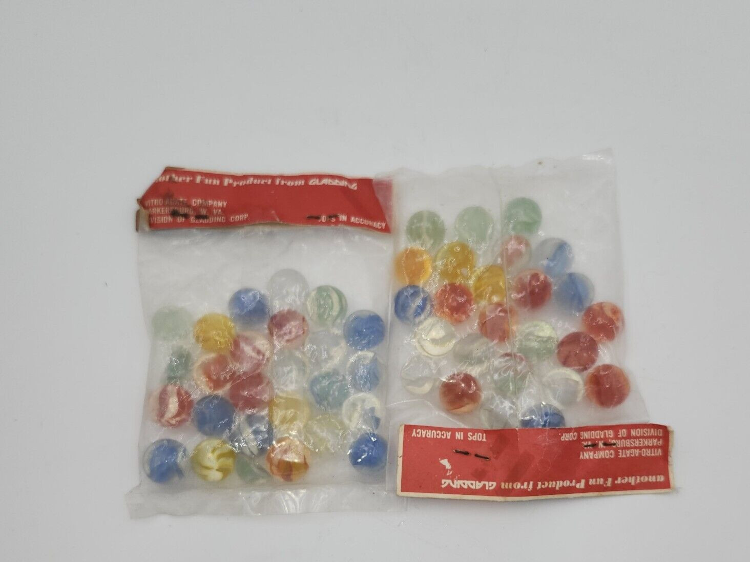 2 VINTAGE GLADDING VITRO AGATE 25 COUNT BAG OF CAGED FINGERED CAT EYES MARBLES