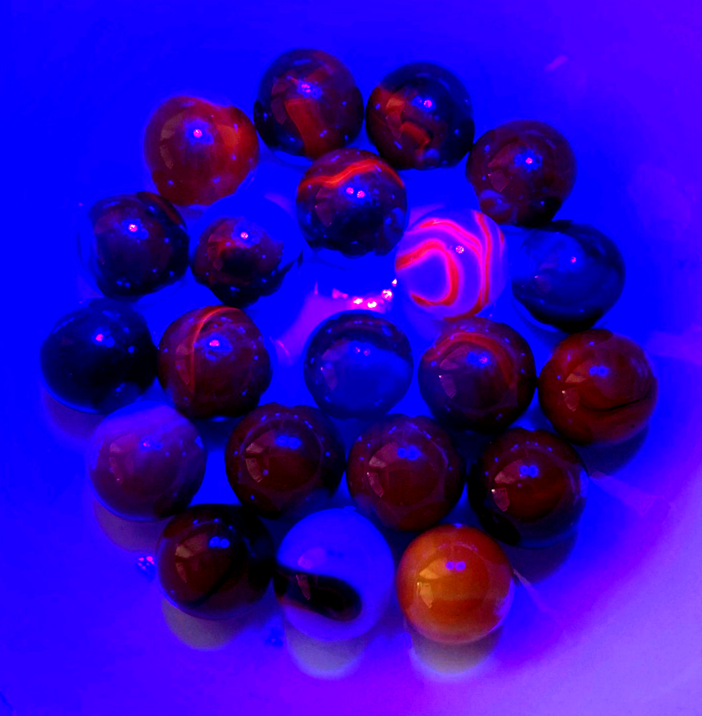 Lot of 21 Assorted Cadmium Swirl Marbles UV Reactive