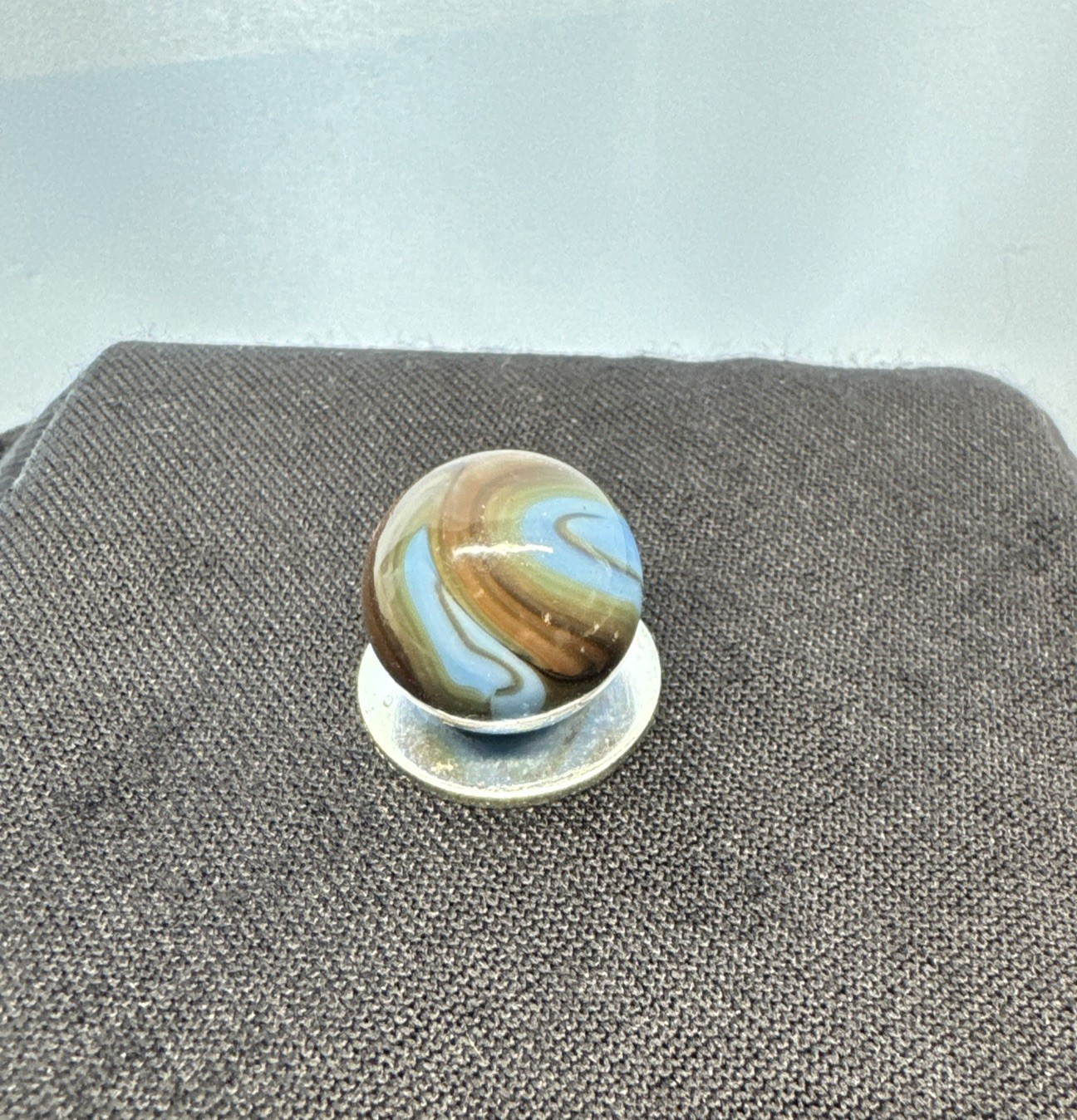 Christiansen Agate Opaque Blue Base With Brown Swirls..63″ Wet Htf Brown