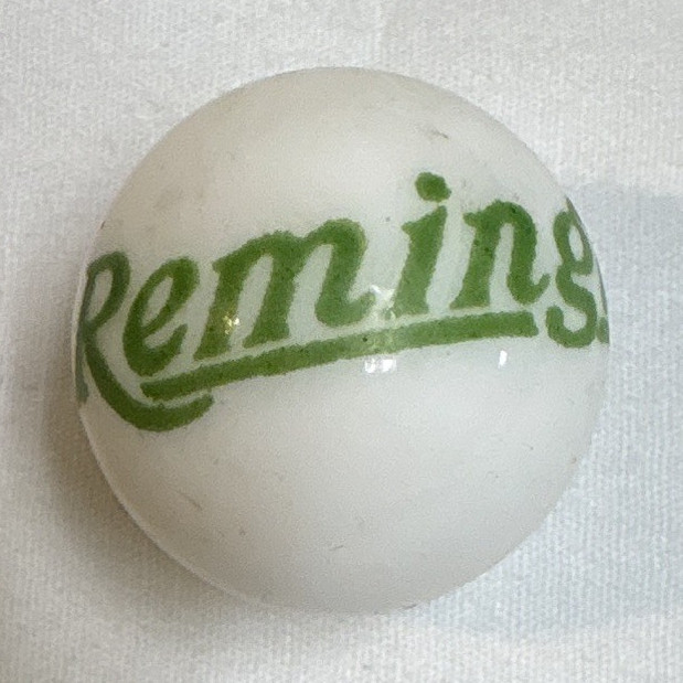 White Logo Printed Toy Marble w/ Green “Remington” Text, Machine Made