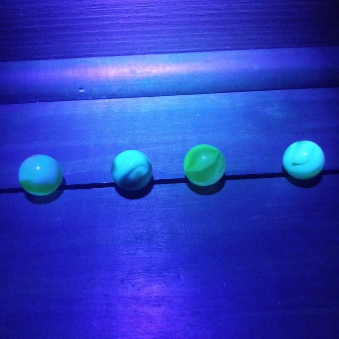4 Vtg Uranium Glass Swirl Shooters Marbles UV Reactive Blacklight Glow Vaseline