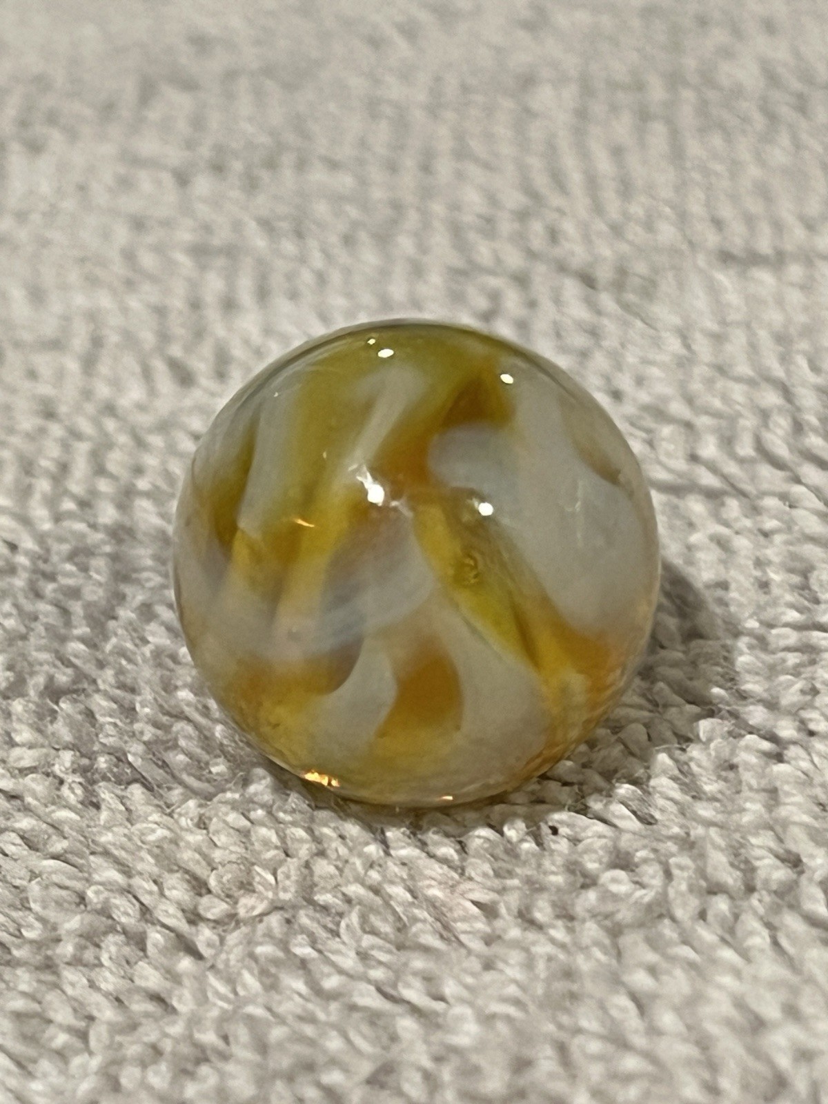 Alley or Champion Yellow Gold Translucent Furnace Swirl .63 Wet Mint