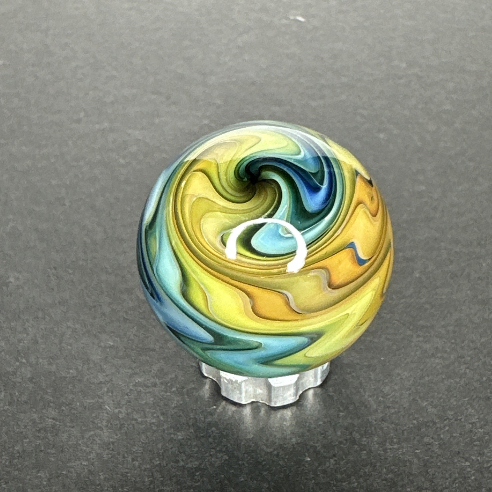 Contemporary Art Glass Marble 1.08″ Wavy Fumed Wigwag W/ UV Reactive Green Glow