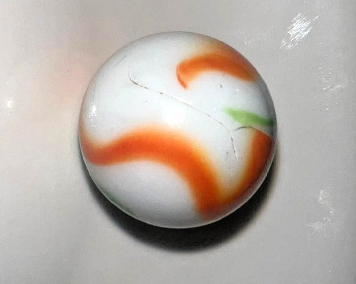 9 classic handmade glass marbles, featuring colorful swirls and unique patterns.