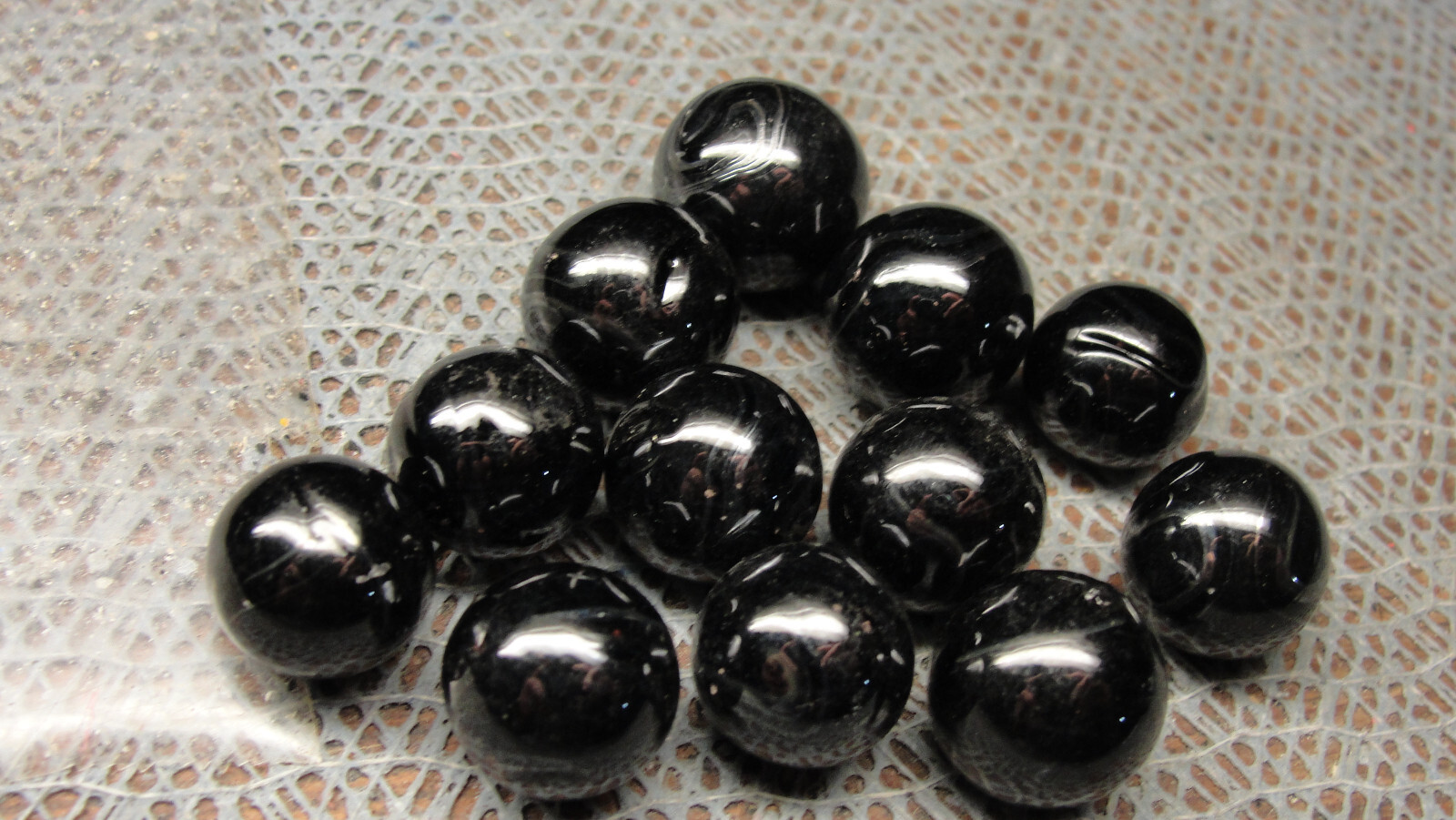 1 dozen Champion marbles black metallics from the 1980’s