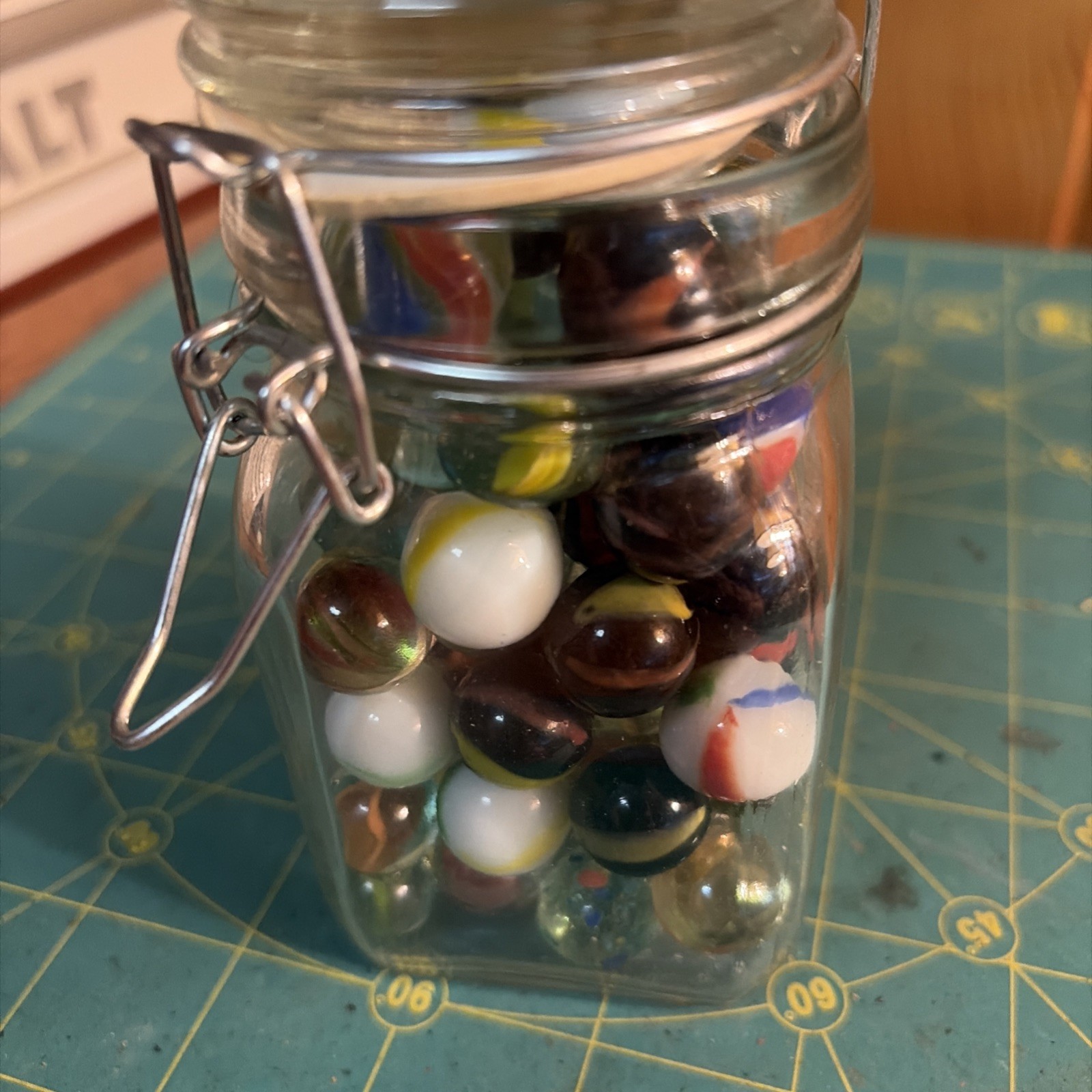 Vintage Set Of 68 Marbles 5” Wire Clasp Jar. Marbles Are Colorful And One Large