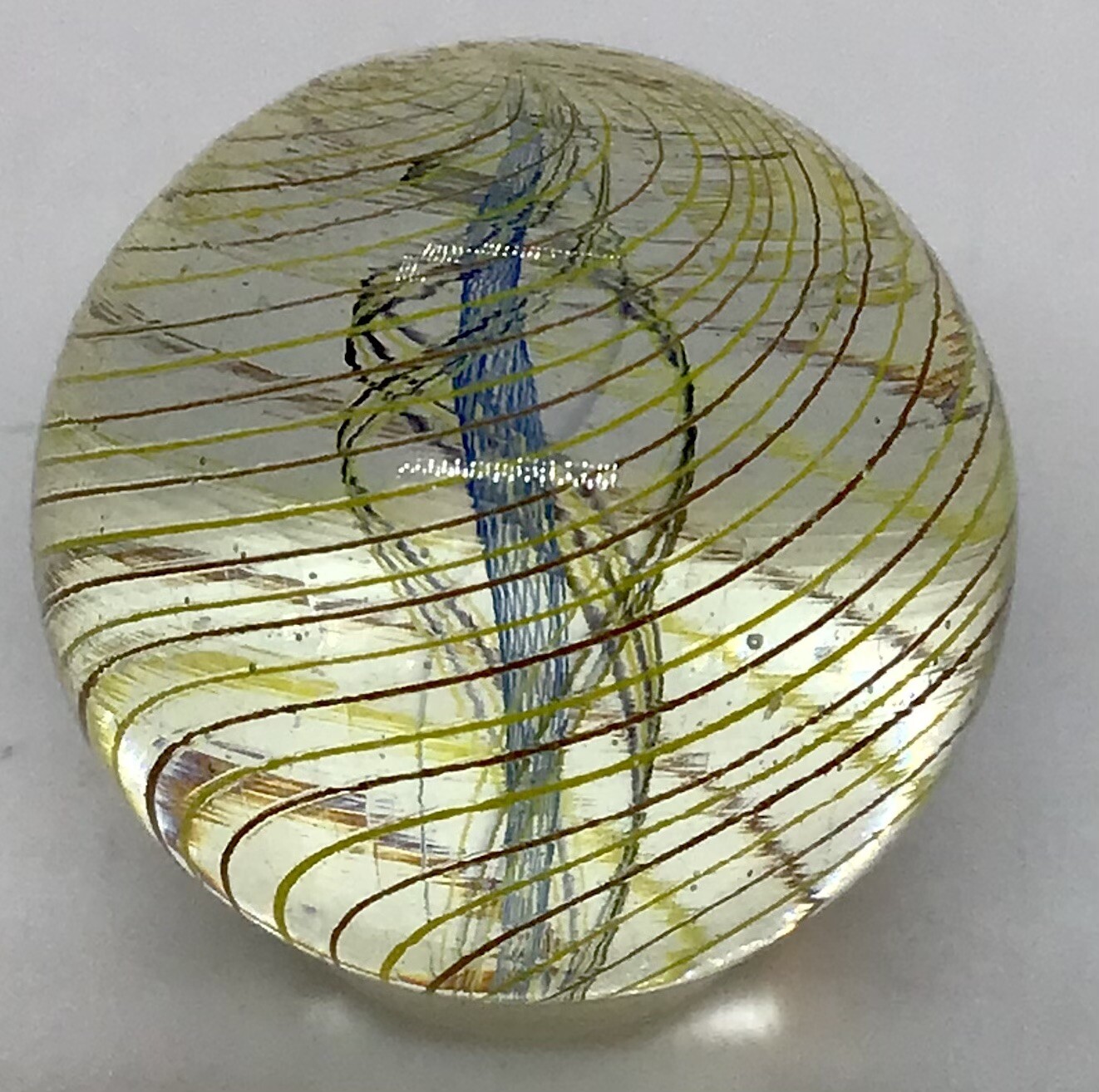 Contemporary Divided Ribbon core marble. It measures .88” in mint condition.