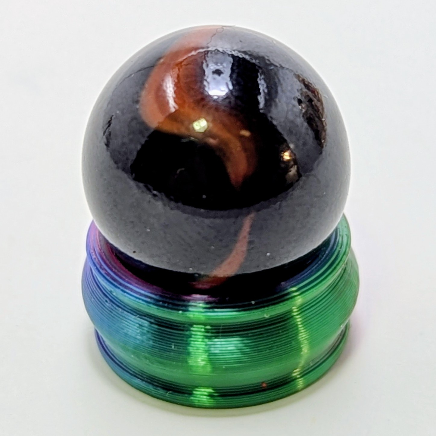 Peltier Glass Company National Line Rainbo Black Tiger Oxblood Wet-Mint 5/8″