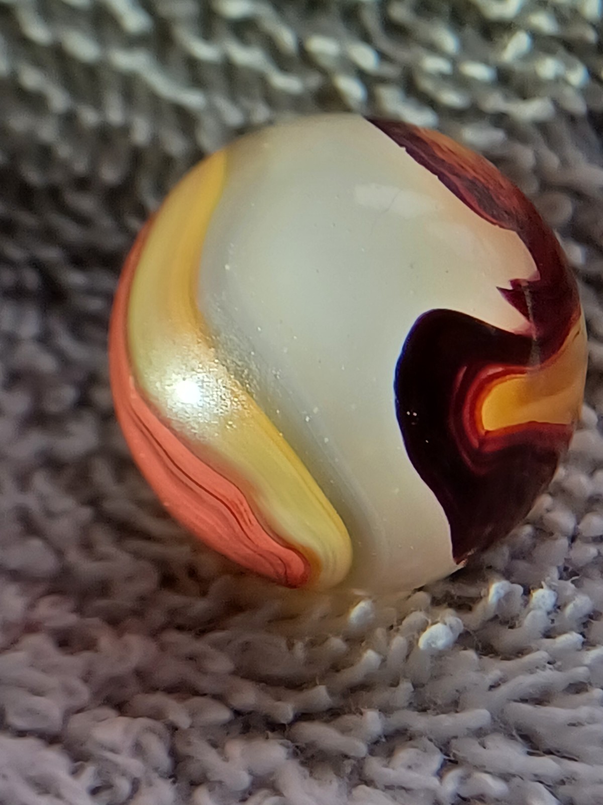 “Golden Onyx Oxblood” .71 Shiney wet dead mint. Very old, rare marble. 1920s (2)