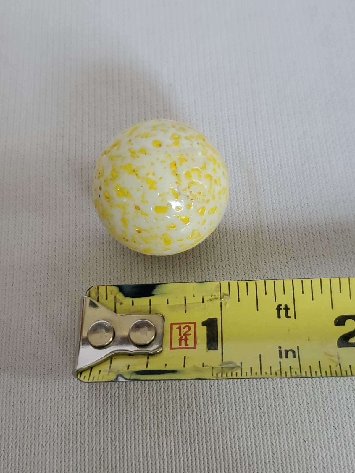 HUGE Vintage 1 & 5/16″ White W/Yellow & Gold Speckled Shooter Marble Peltier