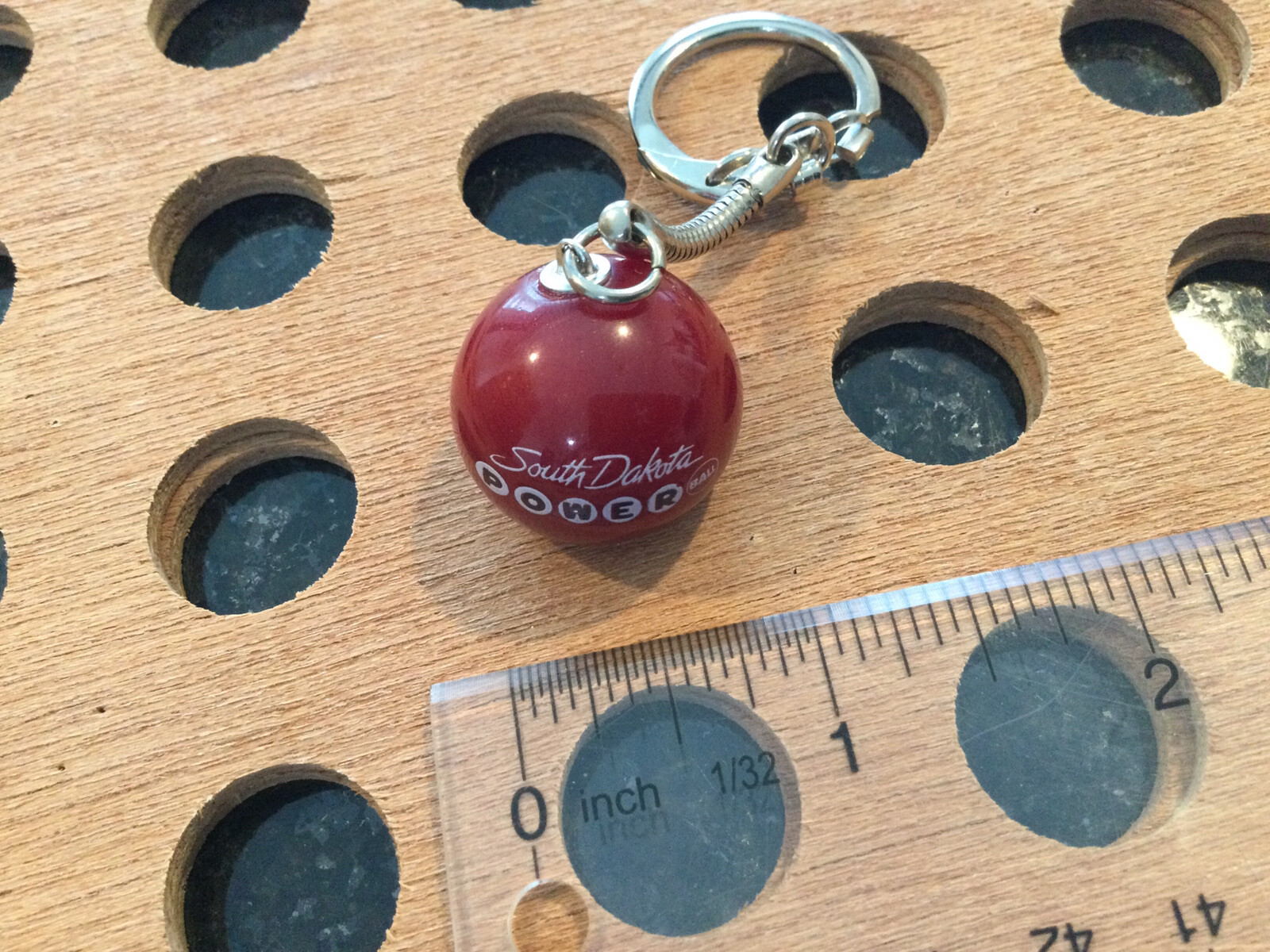 Vintage |”South Dakota Powerball”| White & Black Print on Red Marble Keychain