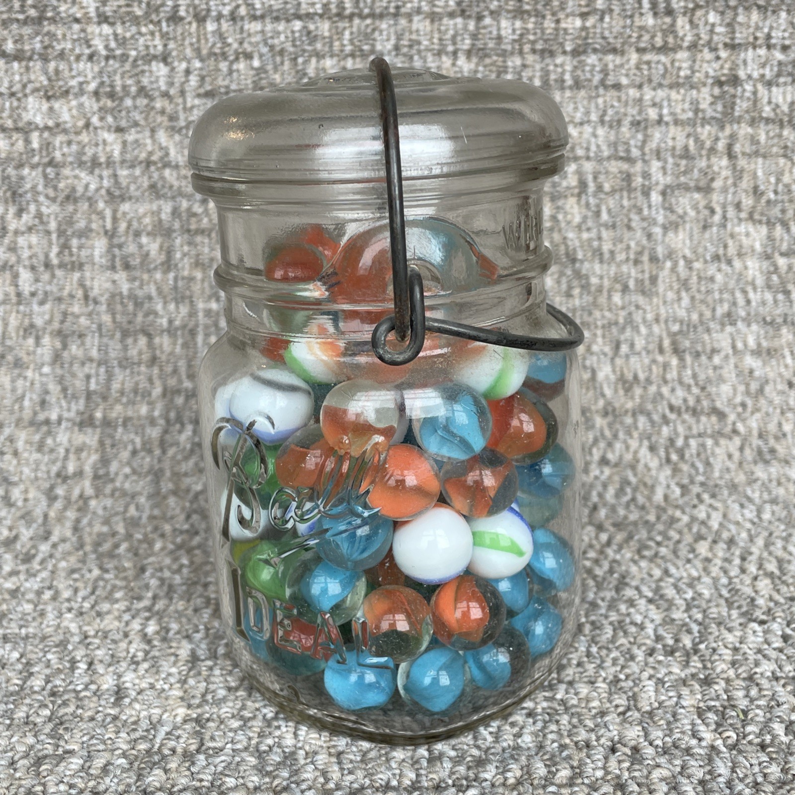 Vintage Glass Ball Ideal Jar Filled With Marbles. Jar Is 5 1/2” Tall.
