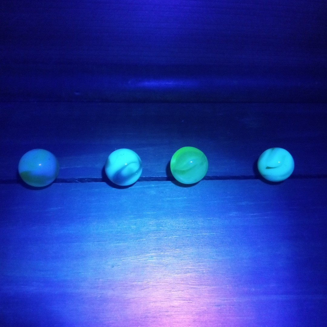 4 Vtg Uranium Glass Swirl Shooters Marbles UV Reactive Blacklight Glow Vaseline