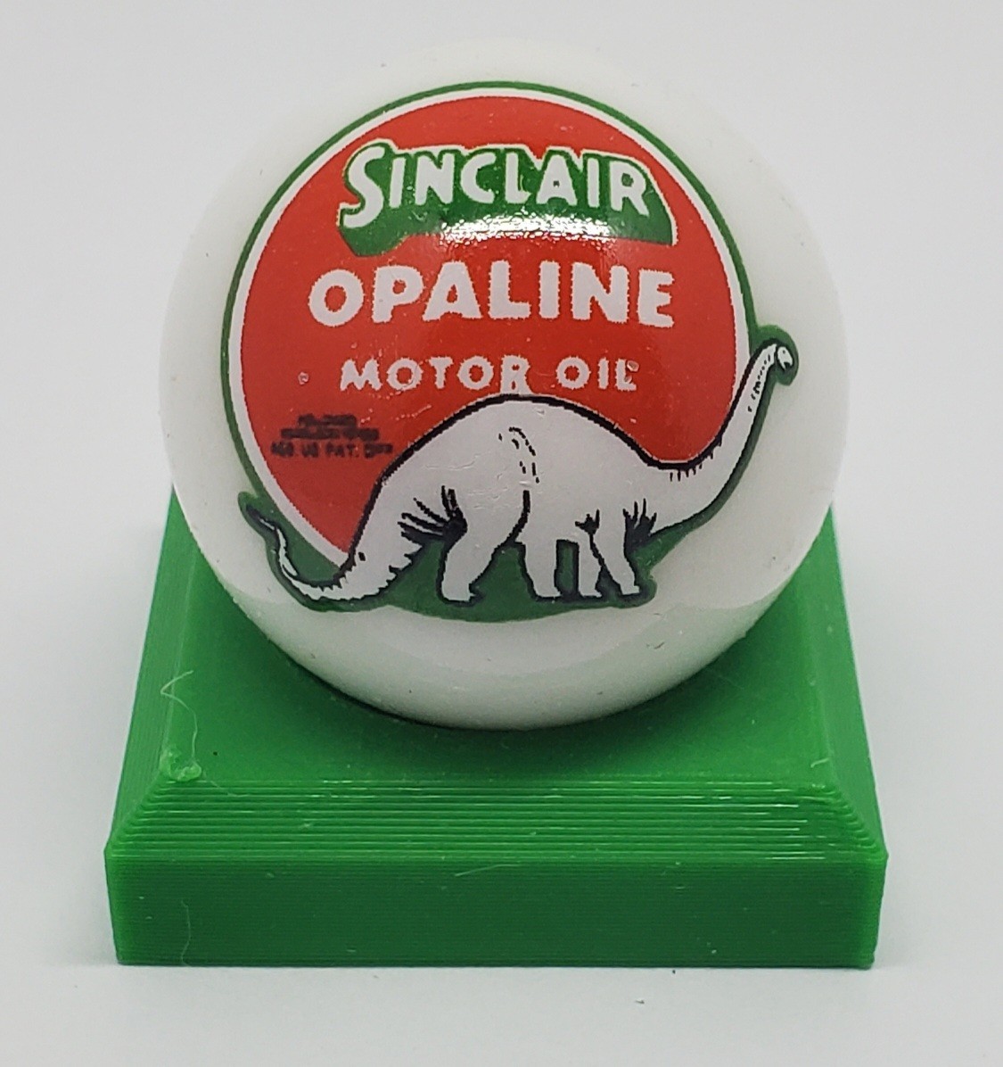 Sinclair Opaline 1″ Glass Logo Marble w/ Colored Stand