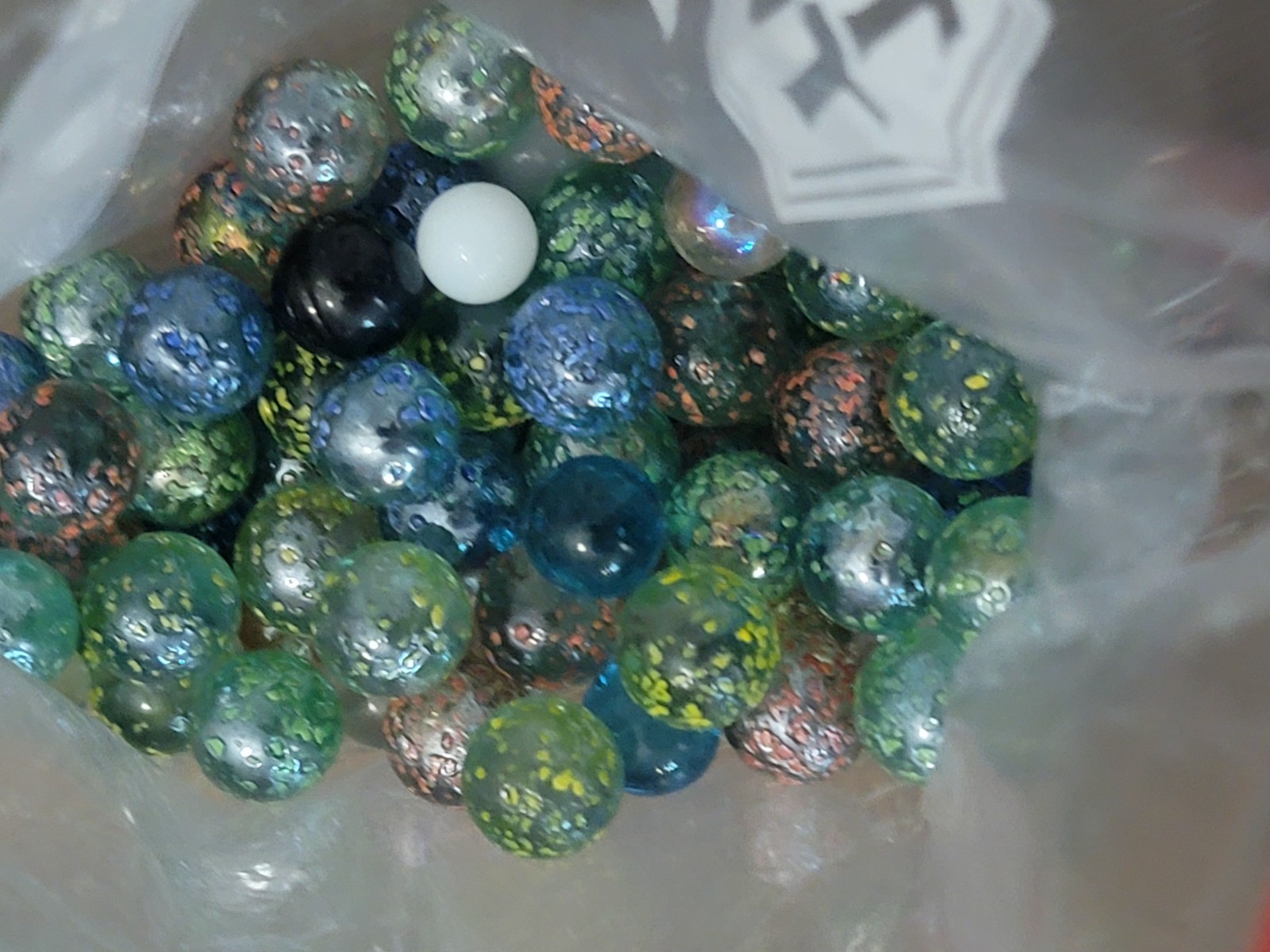 Bag Of Glass Marbles; Different Colors And Some Sizes