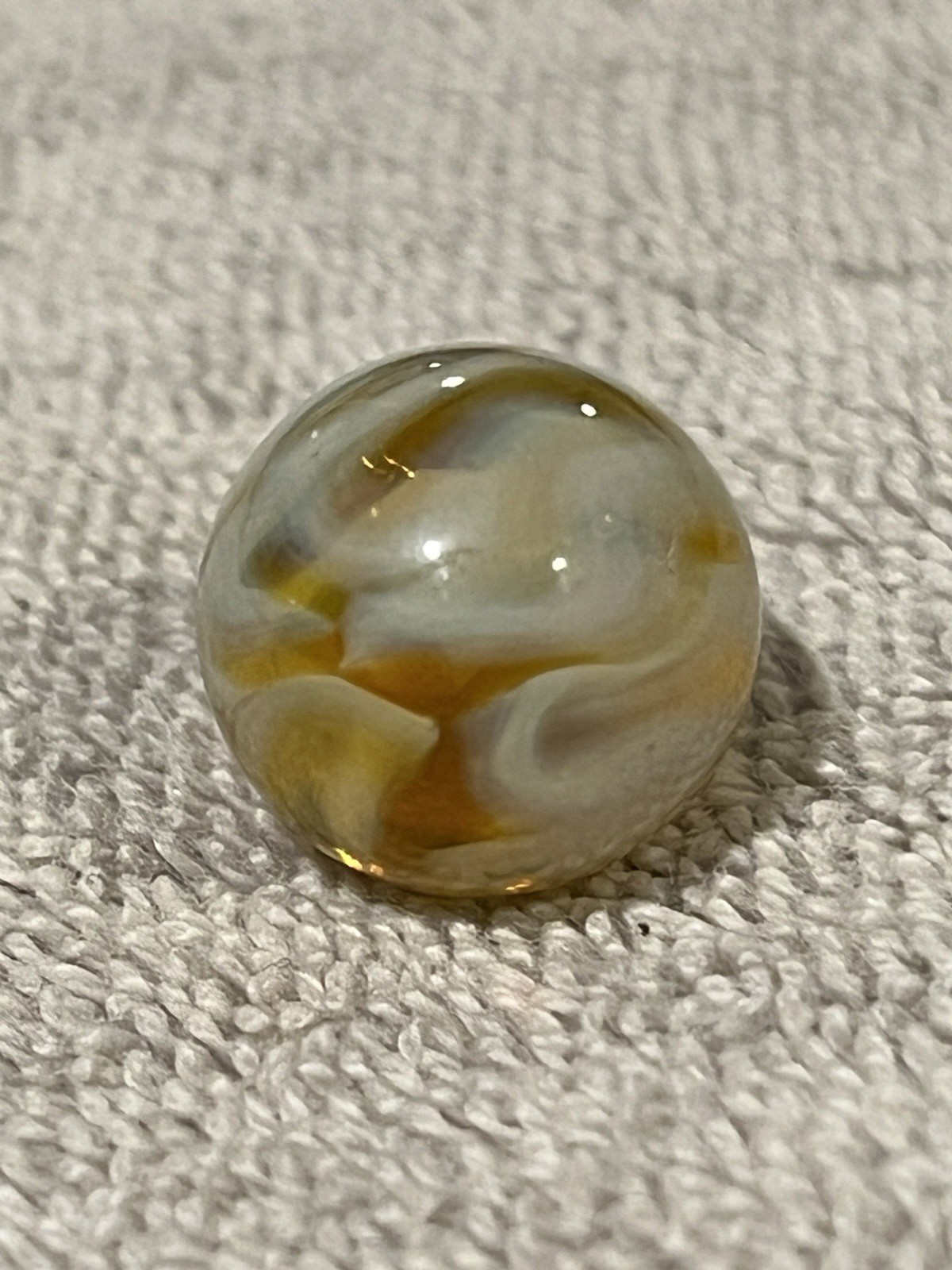 Alley or Champion Yellow Gold Translucent Furnace Swirl .63 Wet Mint
